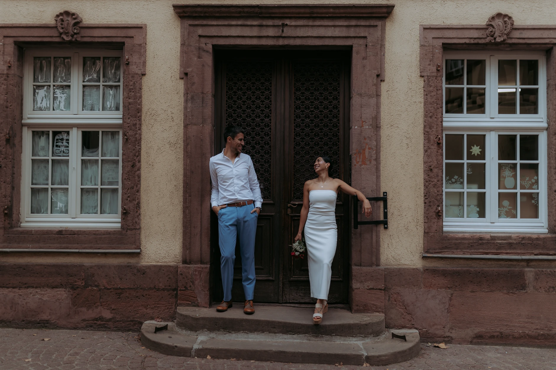 Couple in a symmetrical doorway