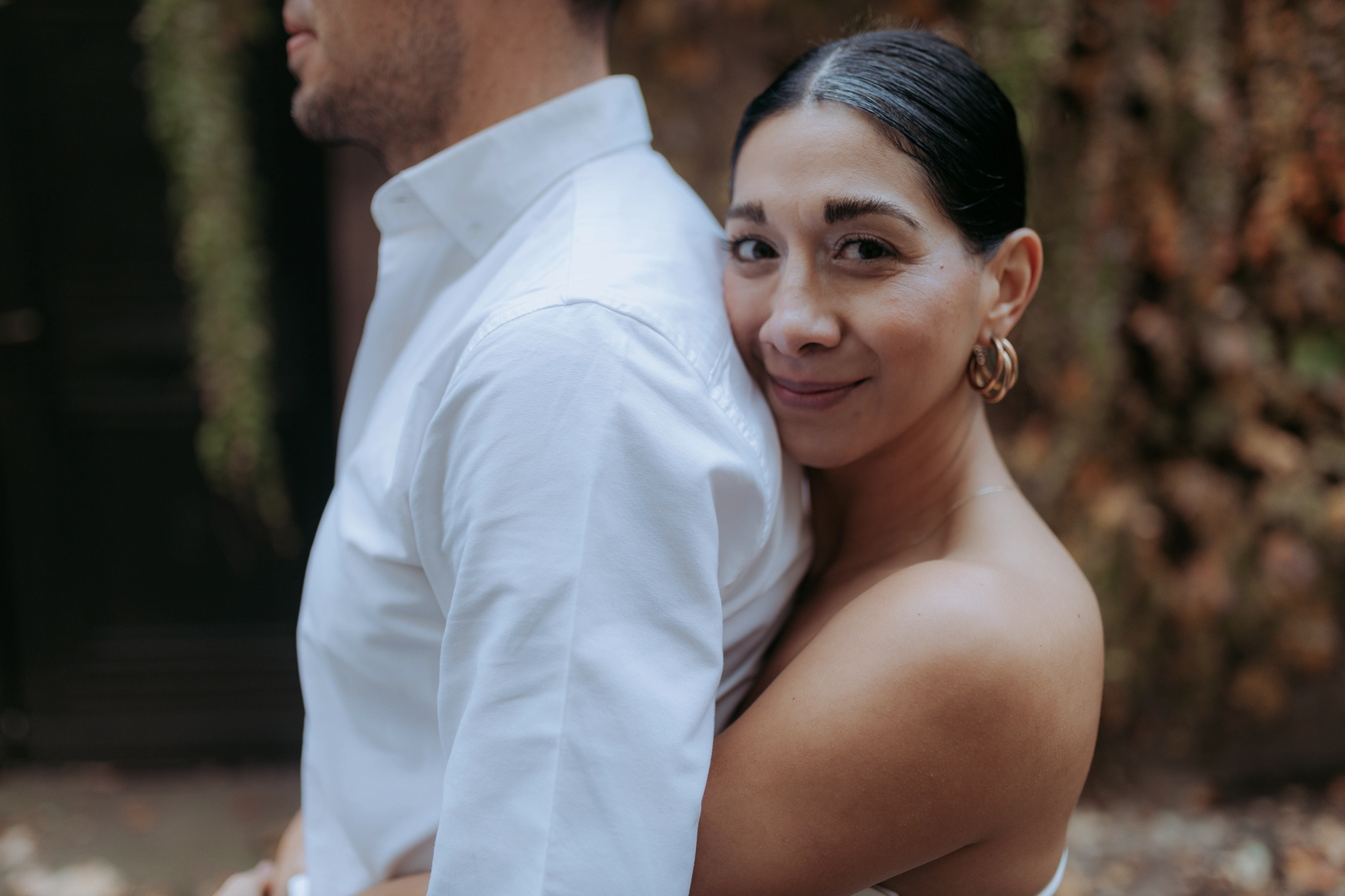 Portrait of the bride glancing back over her shoulder