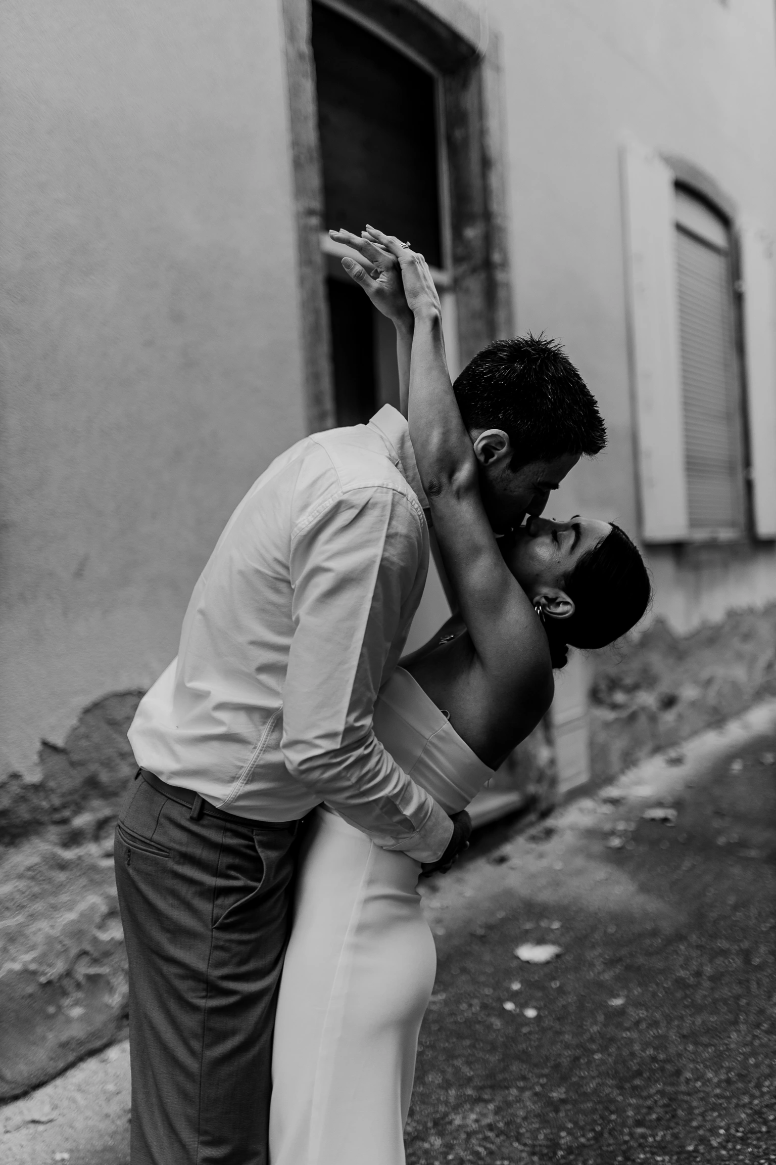 Black-and-white candid — couple walking