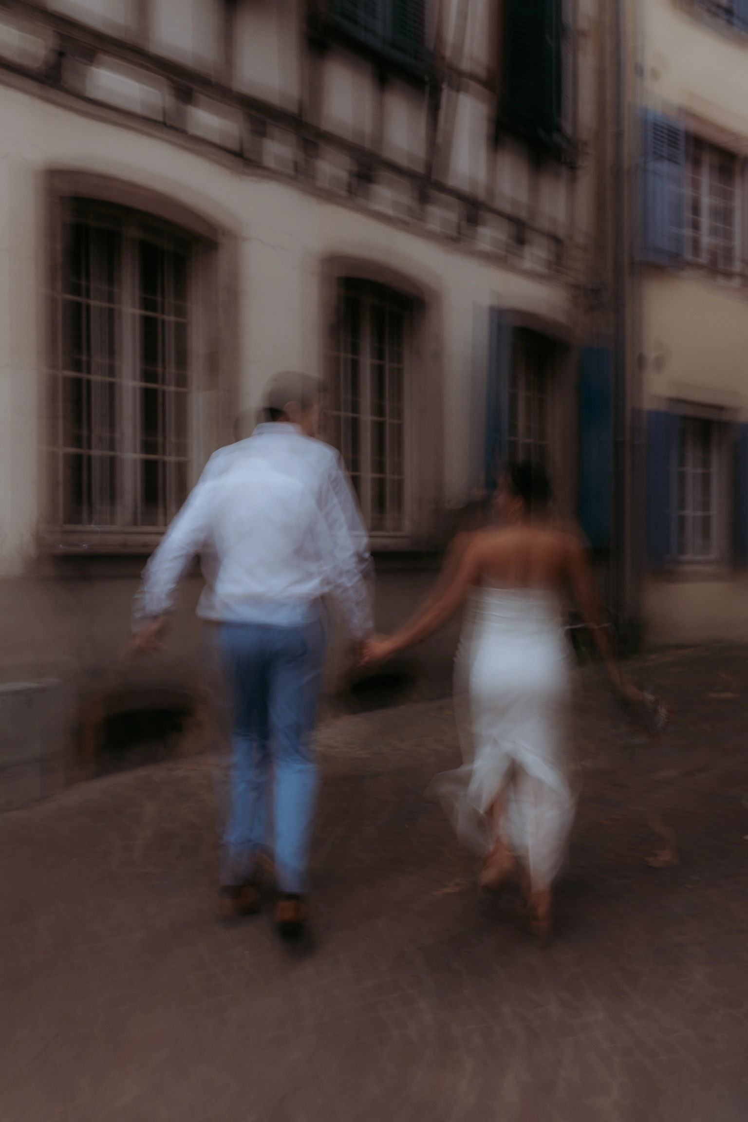Couple walking through an old-town street