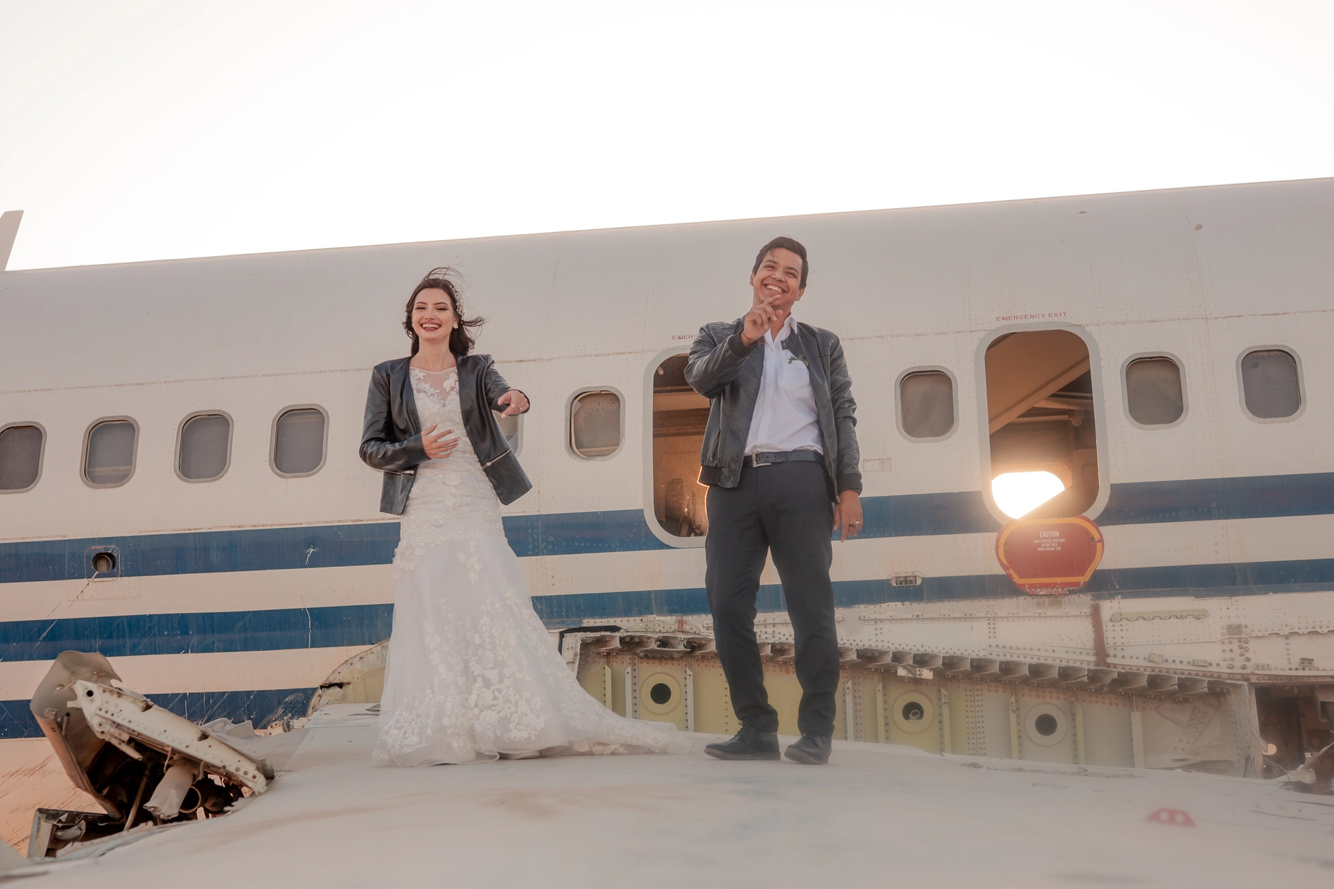 Bride outdoors in front of the plane