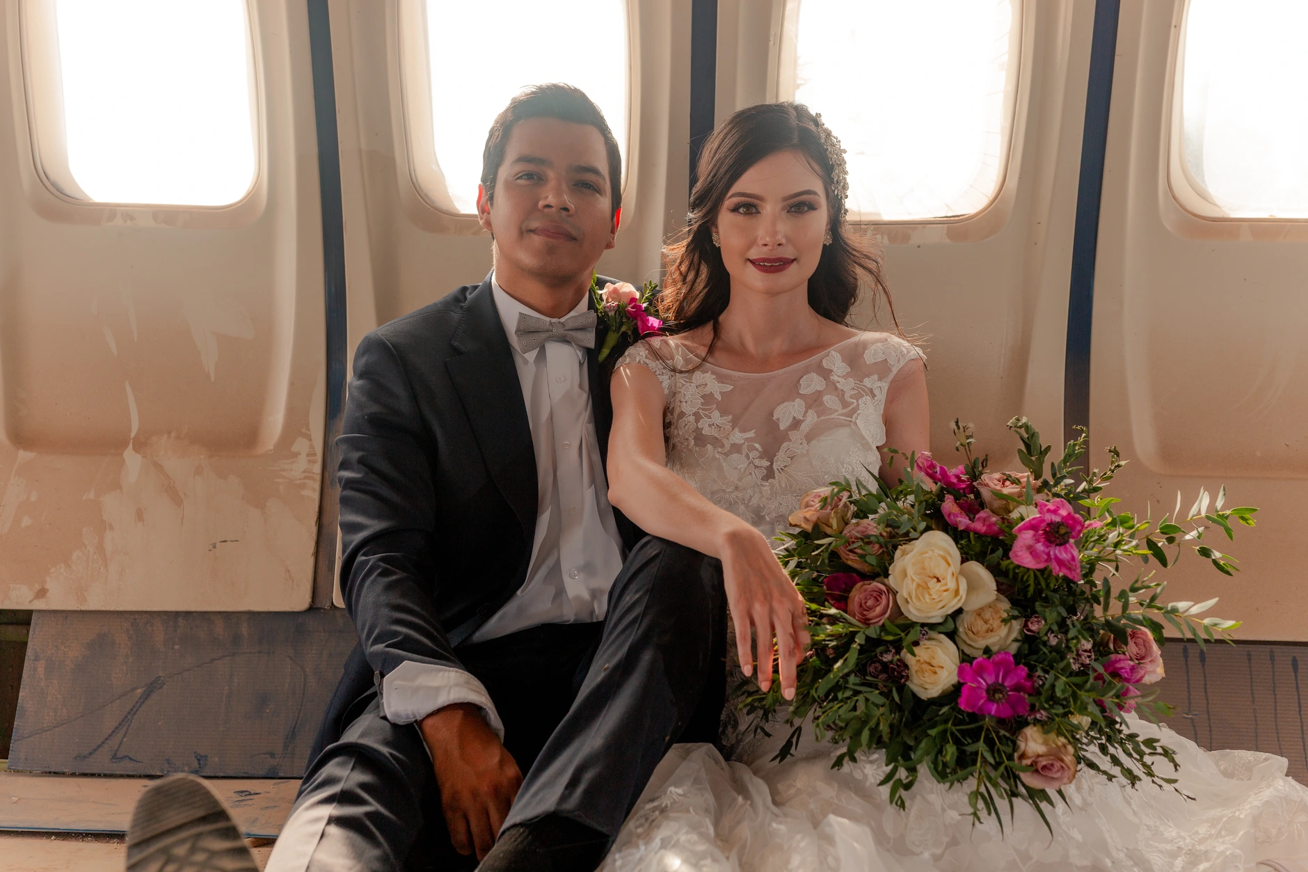 Couple running across the tarmac