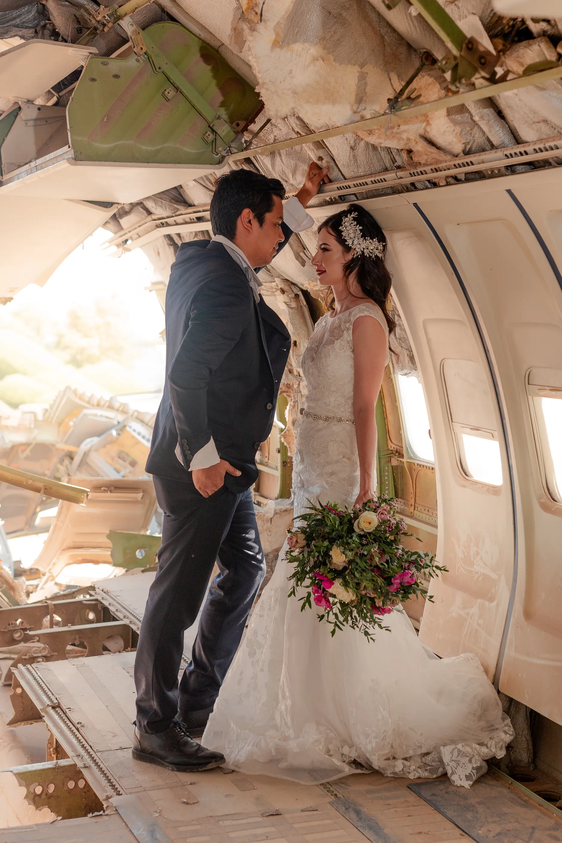 Groom with flowers inside the fuselage