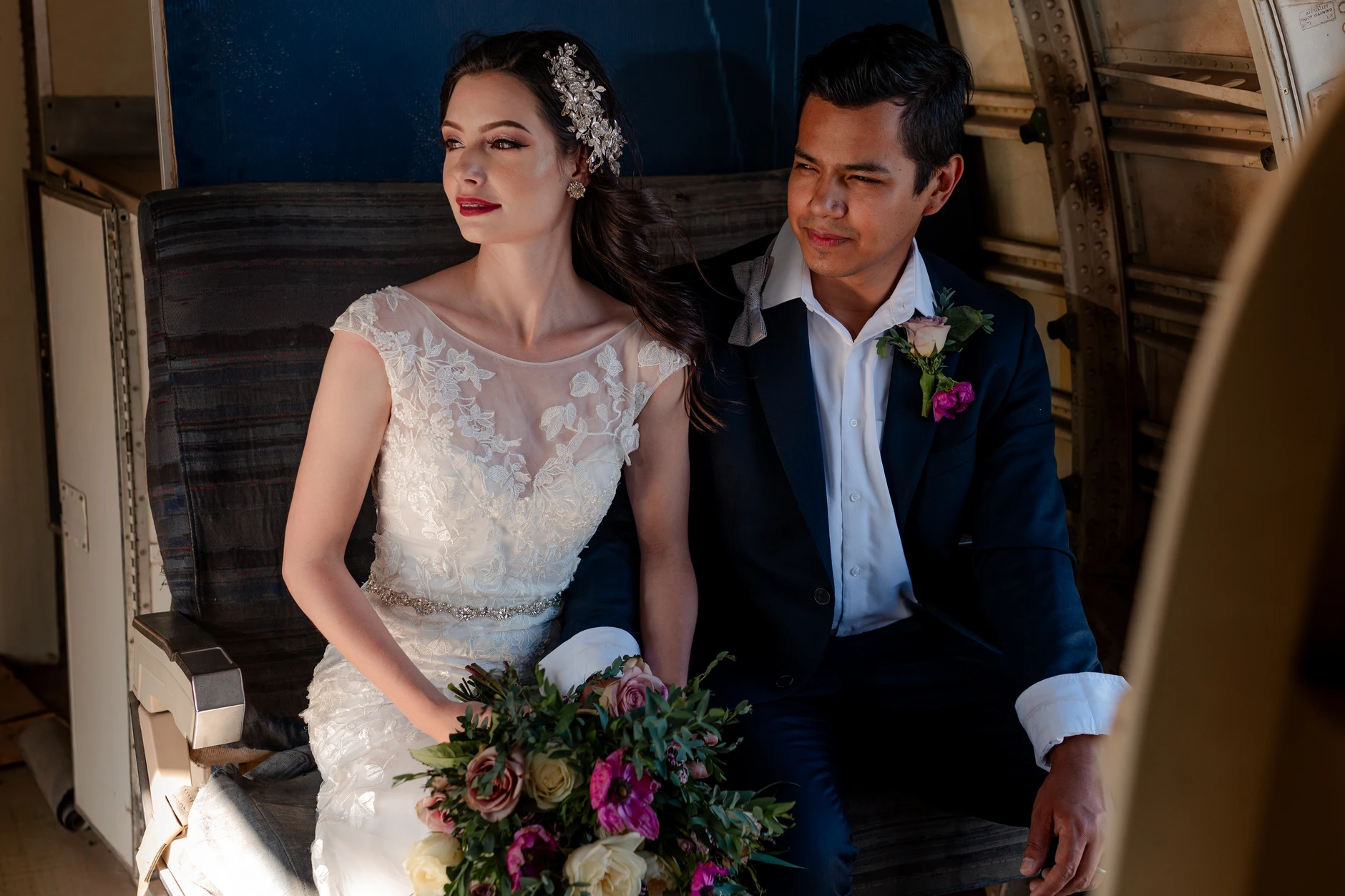 Bride in a vintage look beside the seats