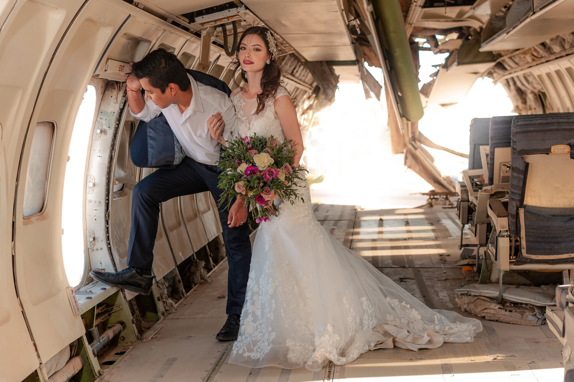 Couple on the step platform with bouquet
