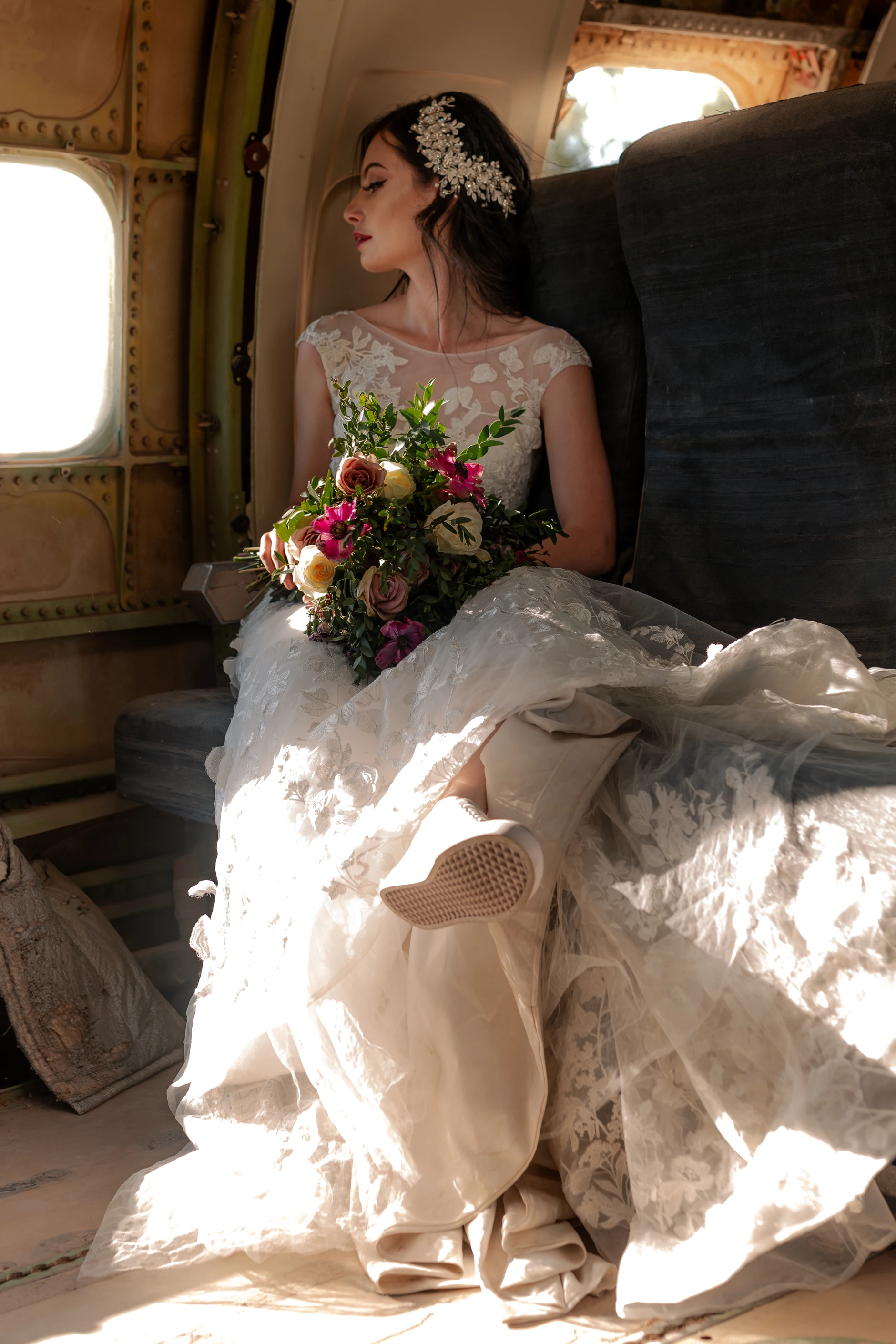 Bride on the floor in a shaft of sunlight