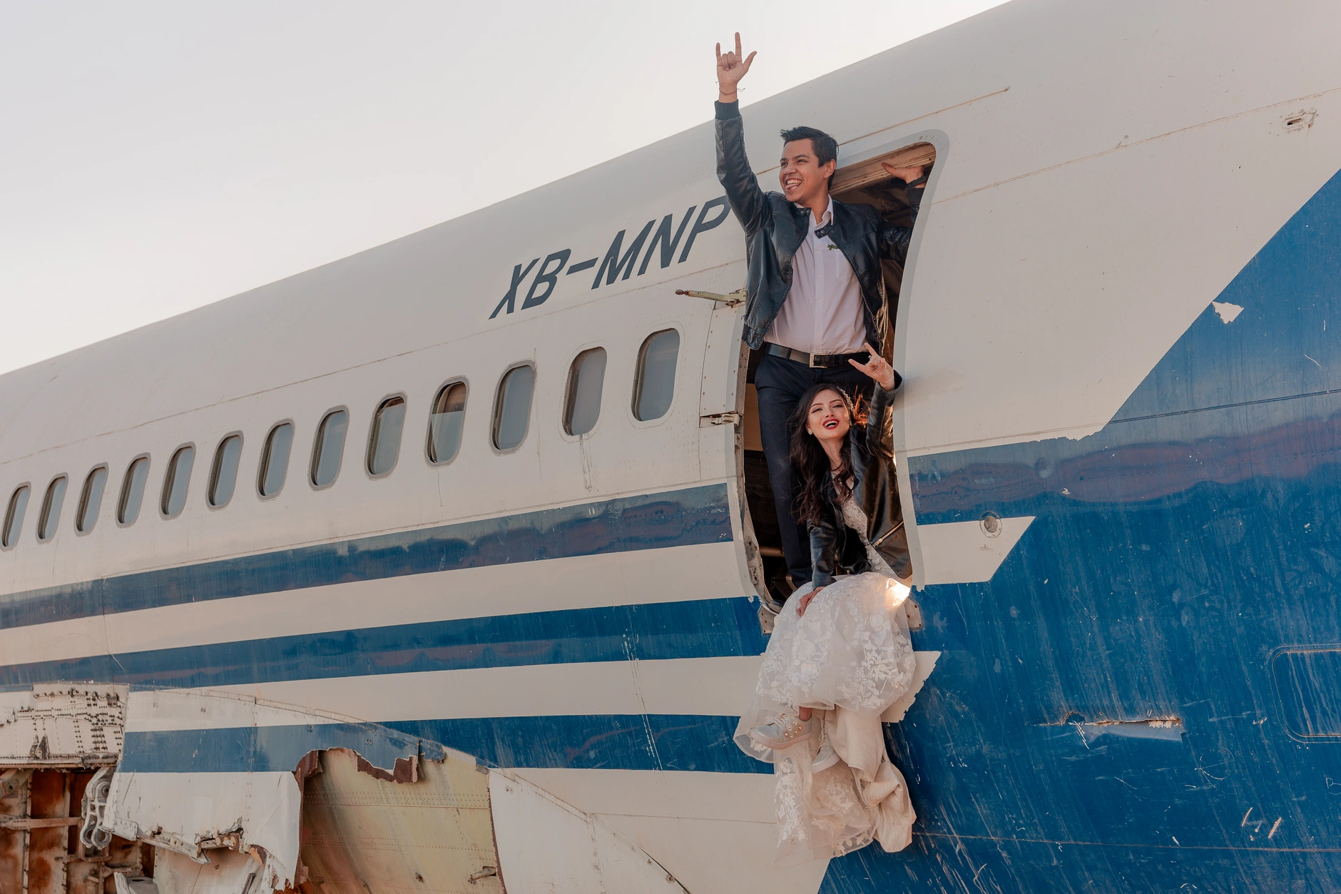 Bride joyfully raising her arms