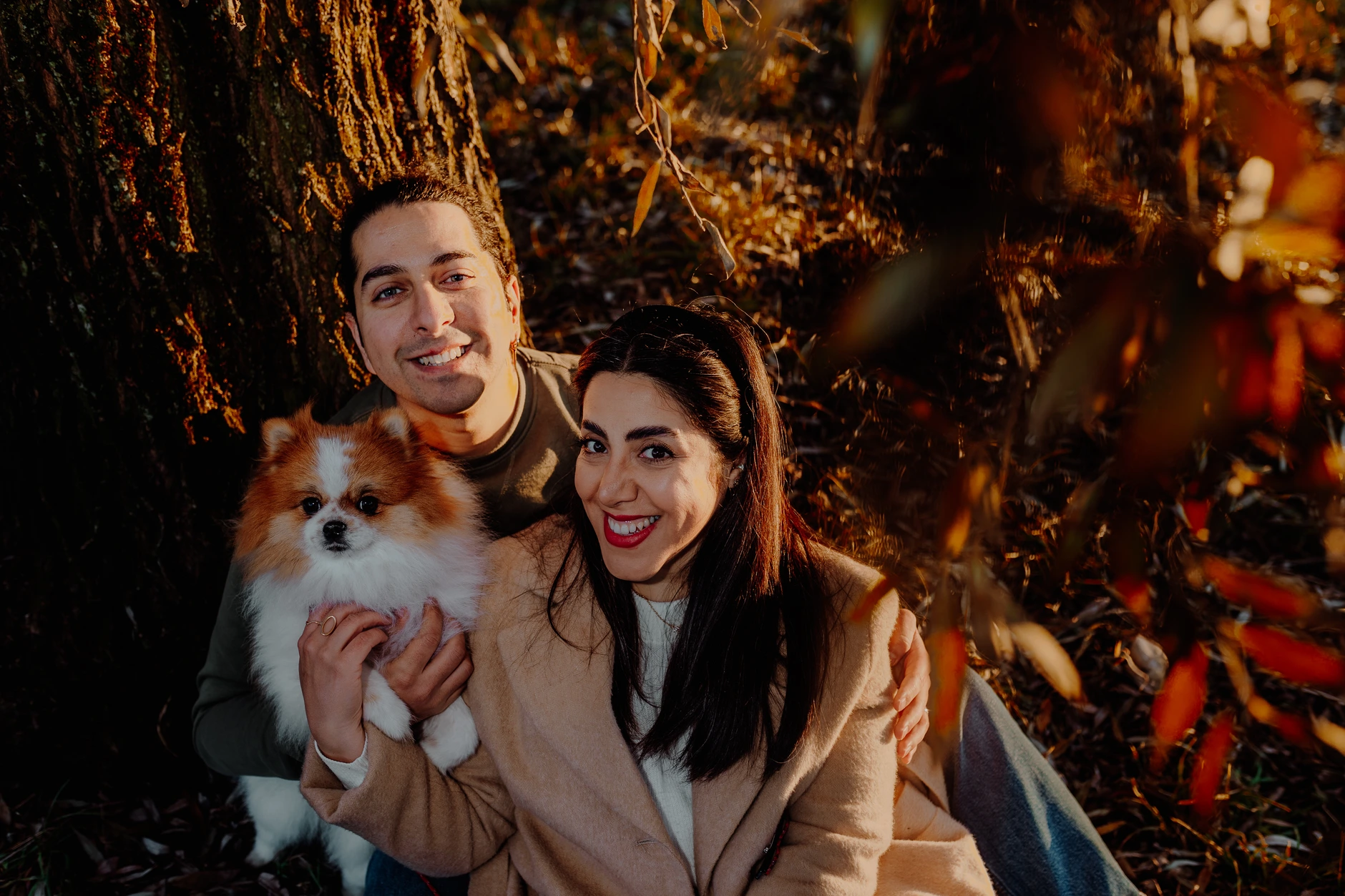 Couple portrait with autumnal bokeh along the river