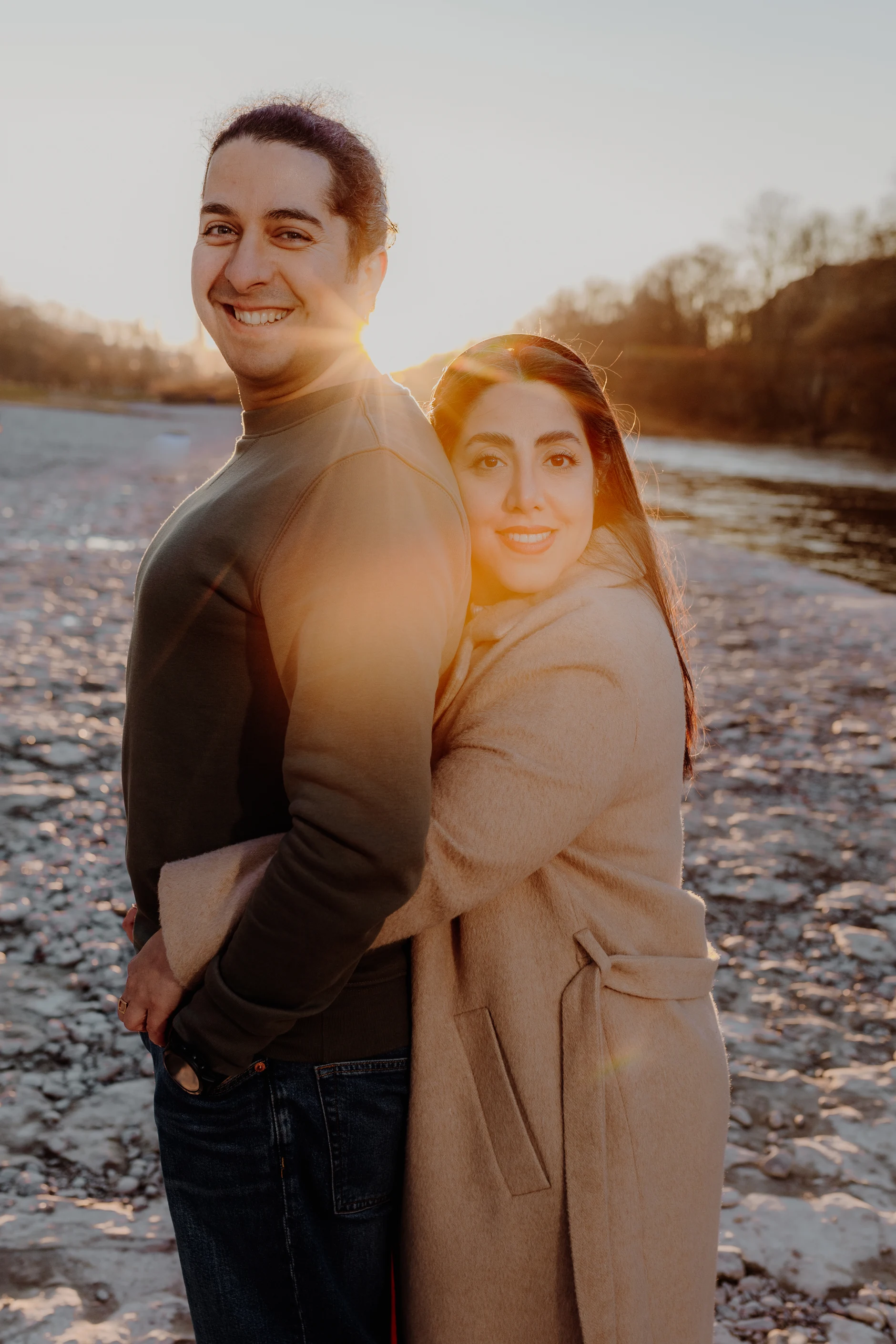 Couple sharing a quiet moment on the riverbank