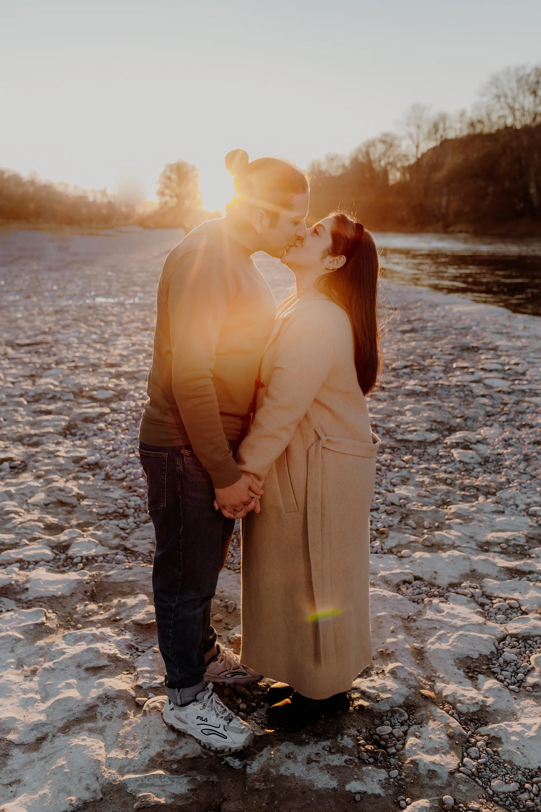 Portrait of the woman with wildflowers and the flowing Isar behind her
