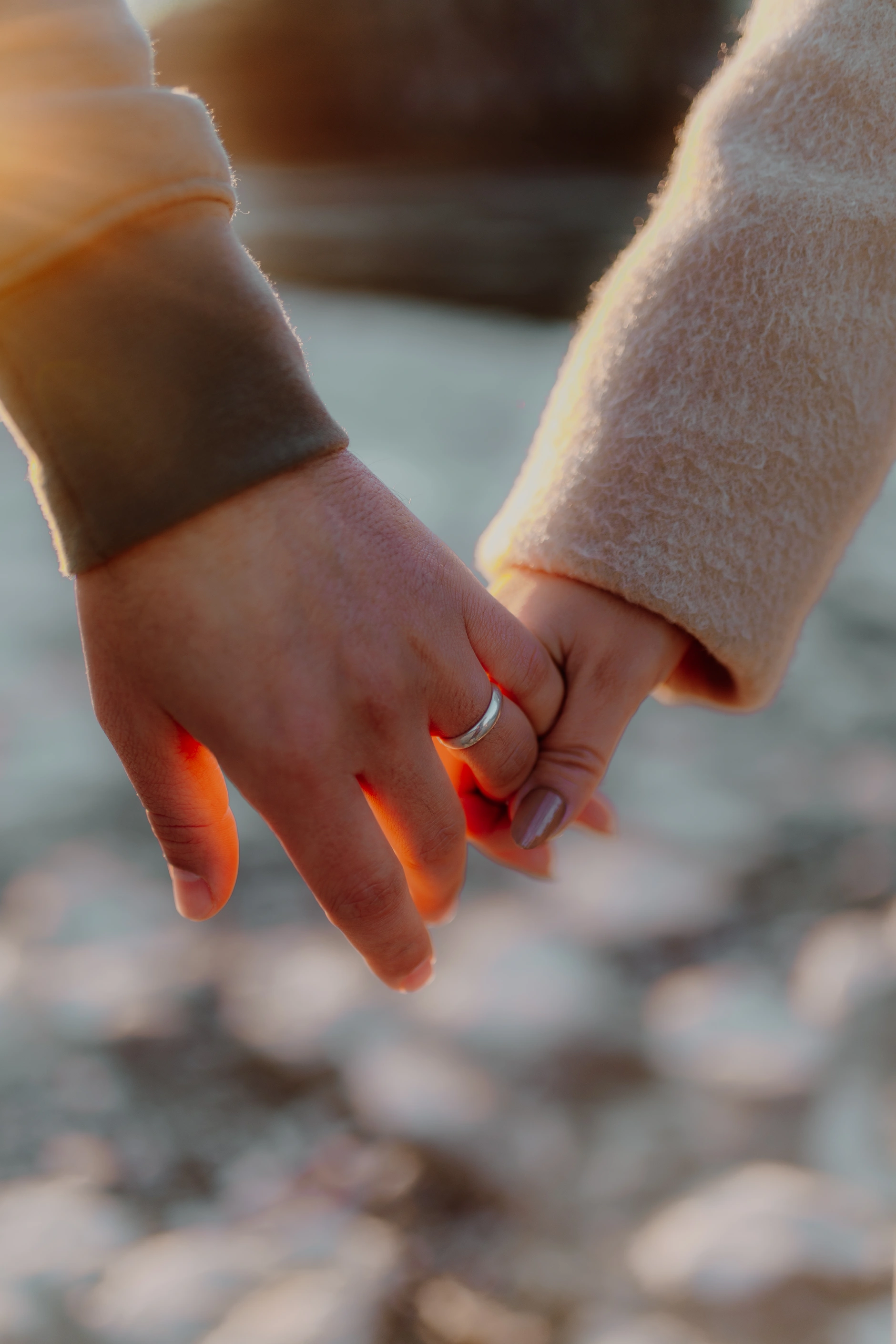 Playful candid — couple laughing on the stepping stones