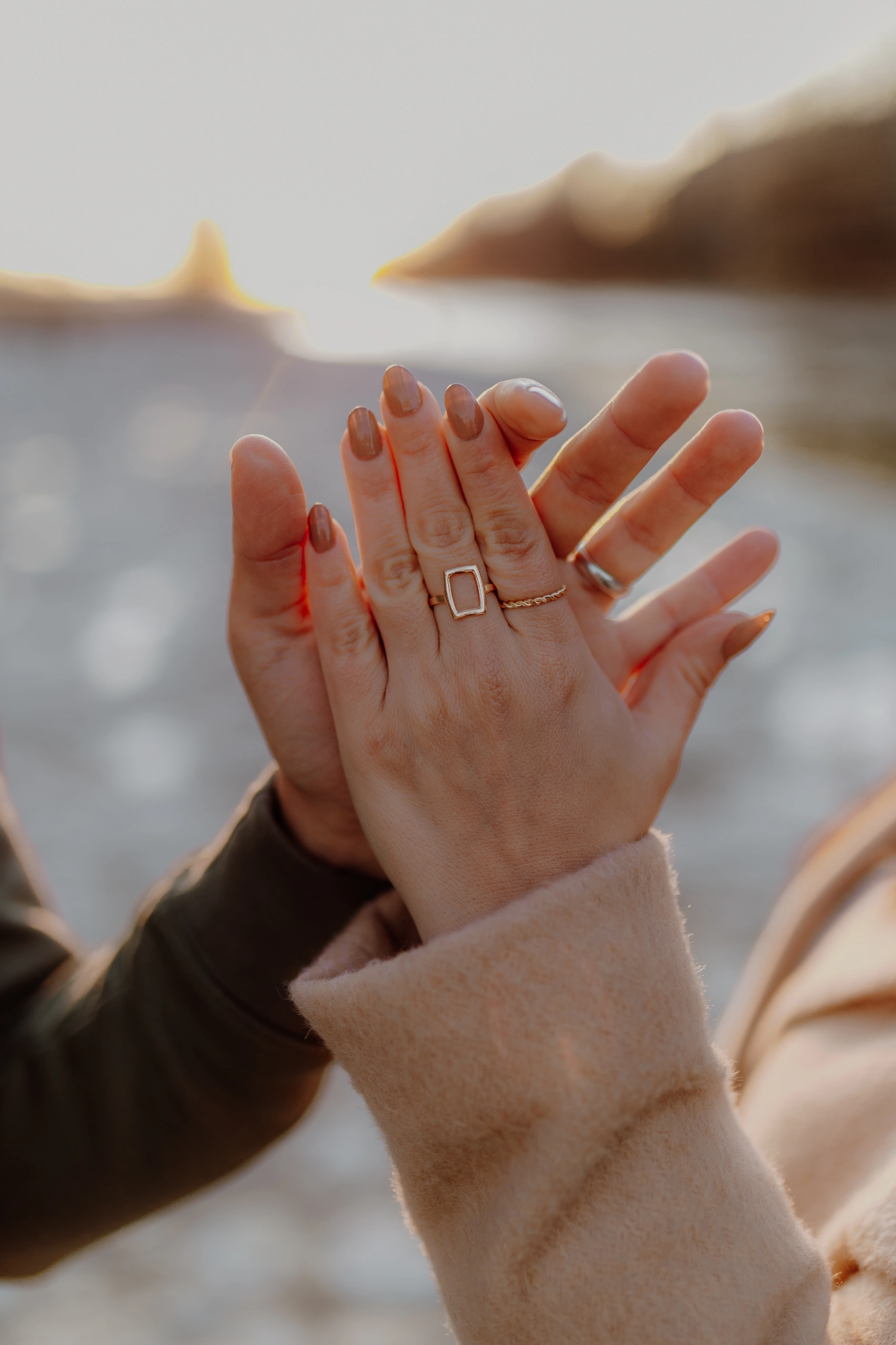 Groom's portrait in warm autumn light at the water's edge