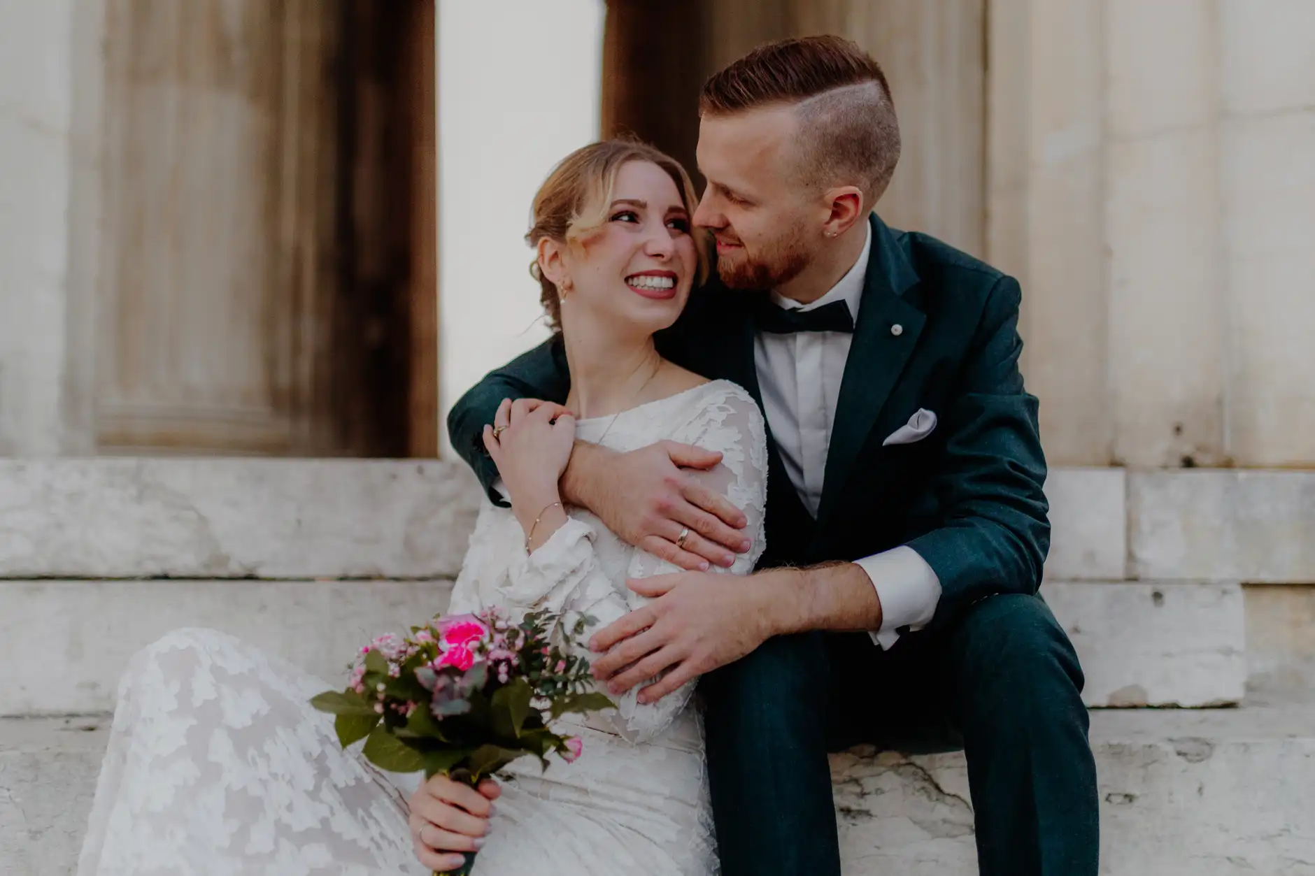 Wide shot of the couple in the vast open plaza