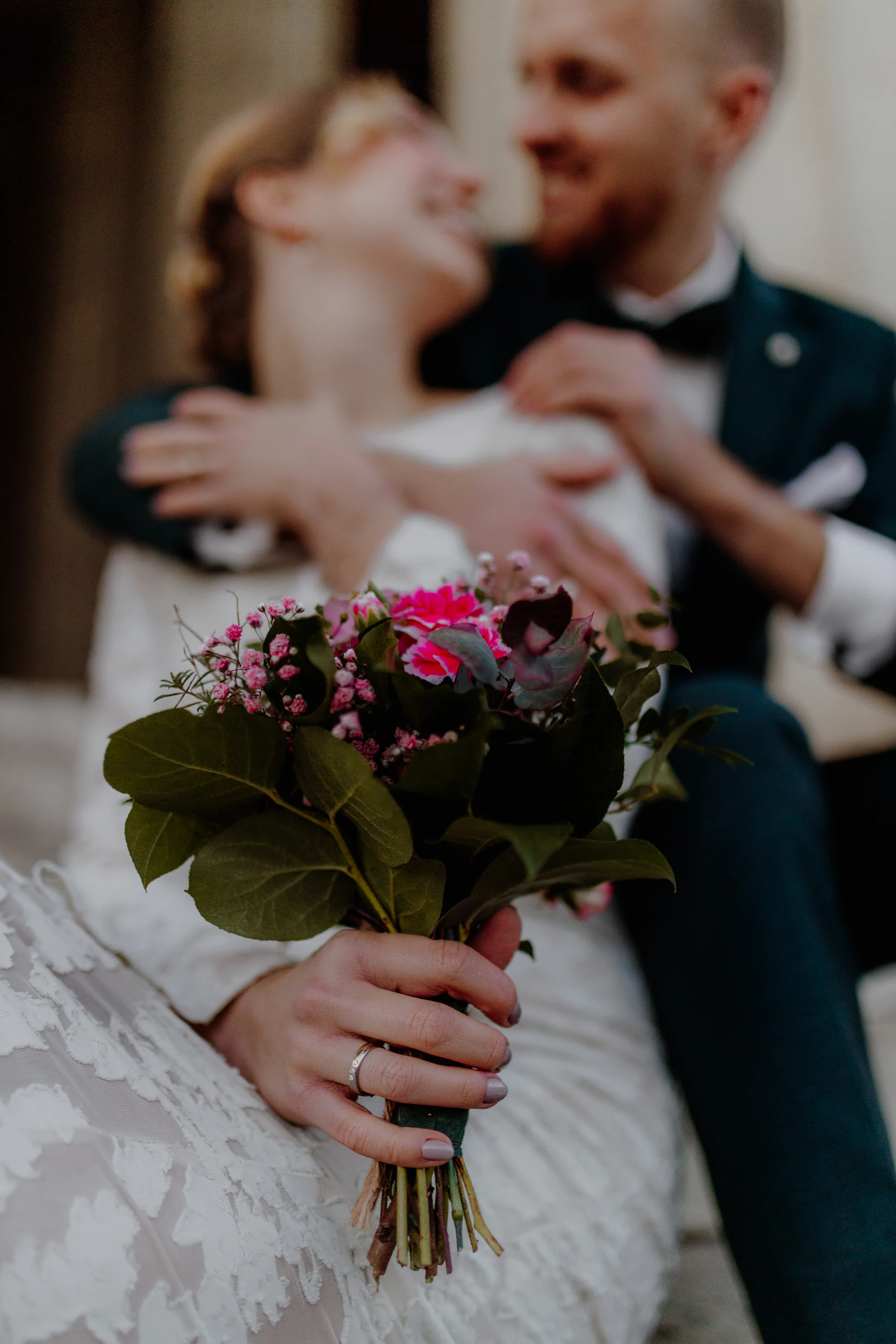 Bride glancing back with a smile in the portico