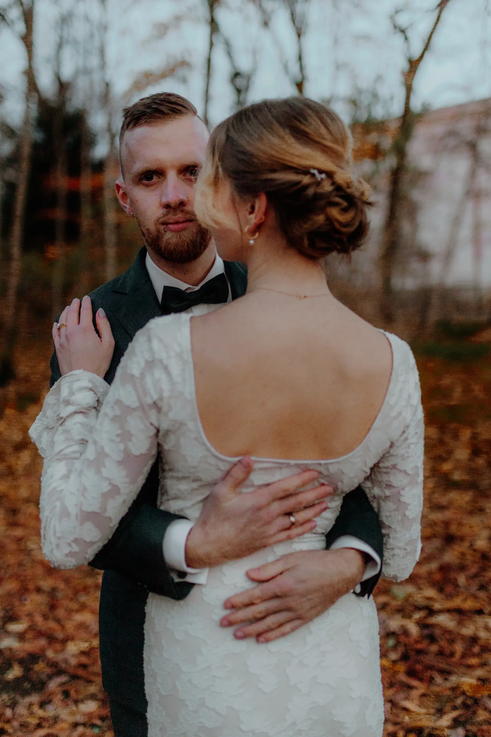 Black-and-white dramatic low angle — columns towering above