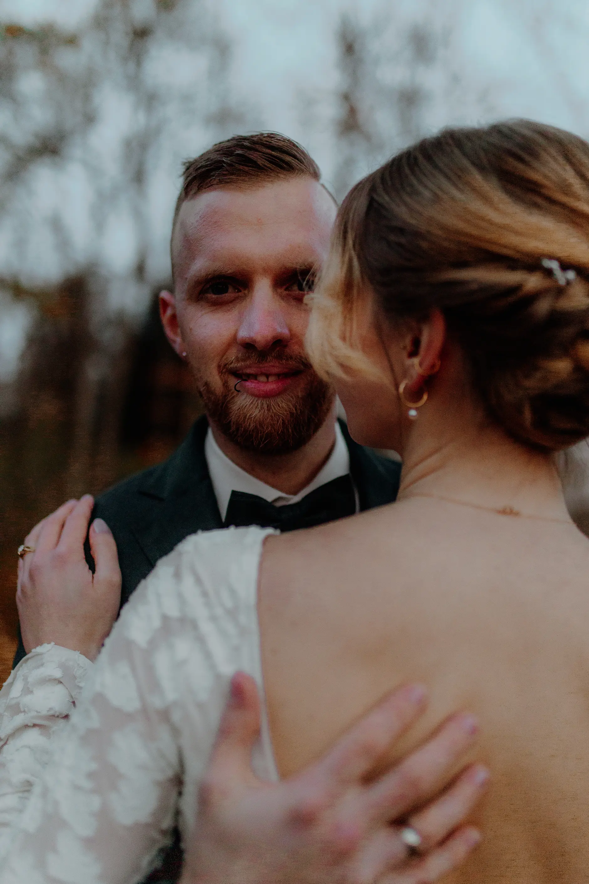 Couple silhouetted at the entrance of the colonnade