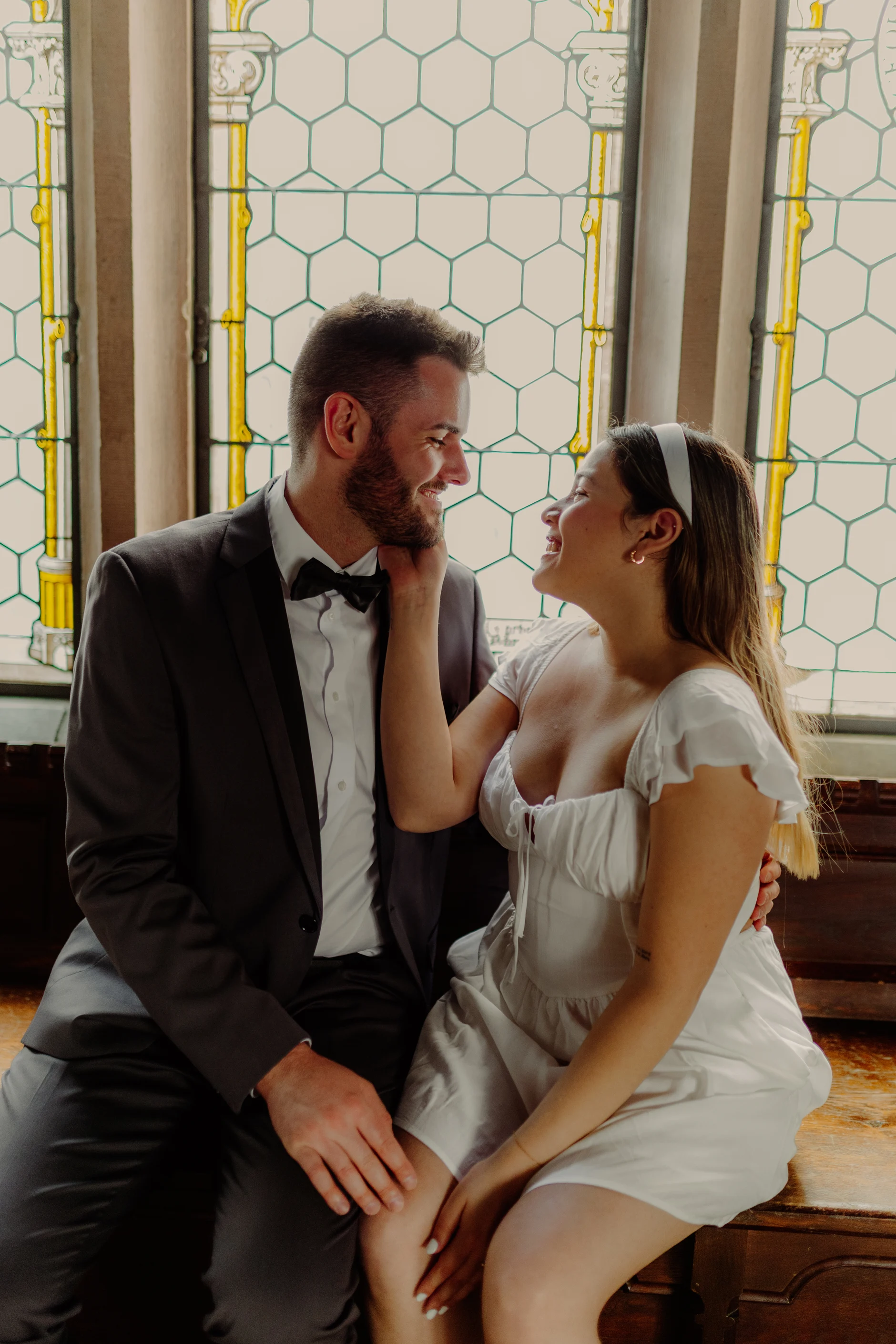 Couple seated together in the historic hall