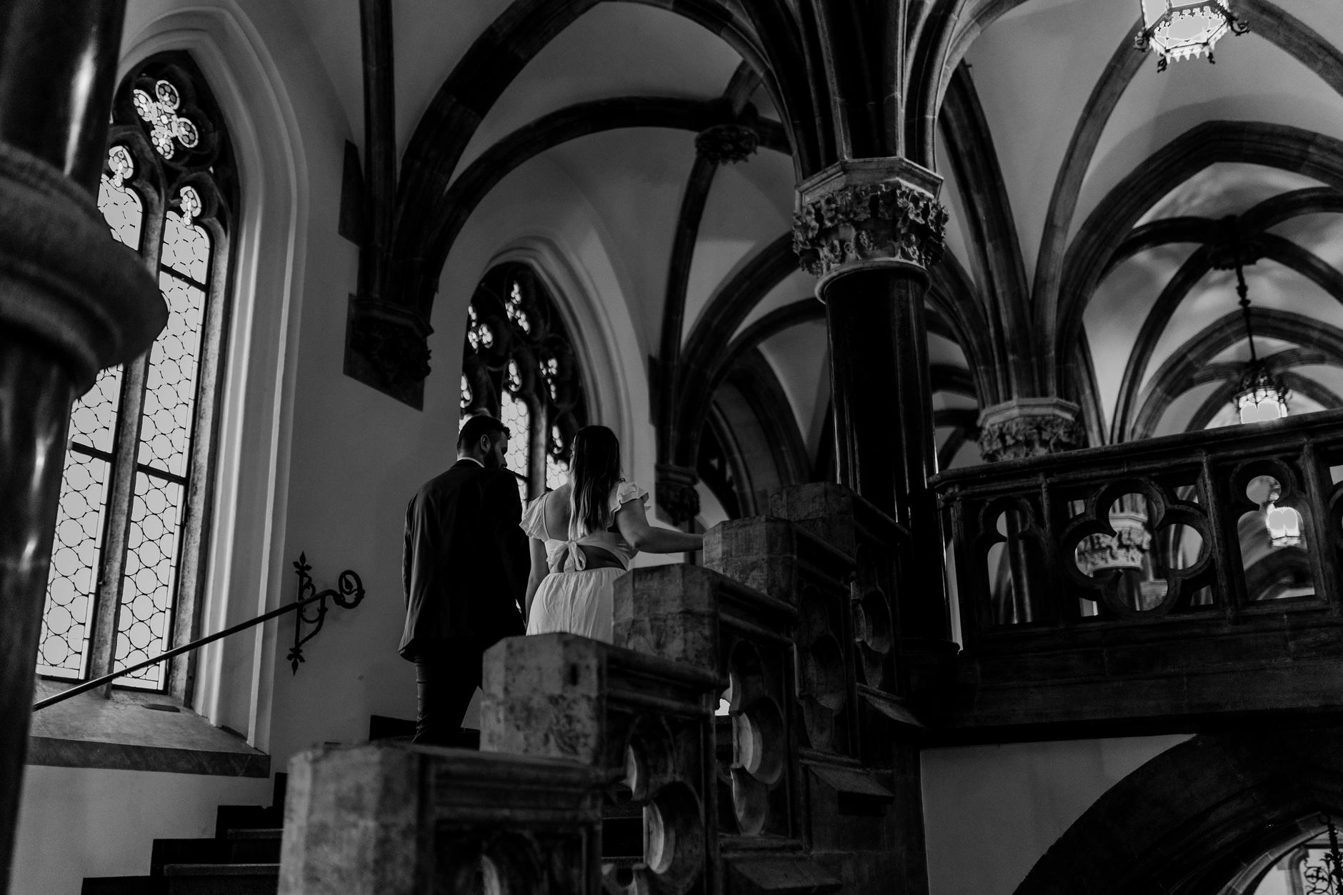 Black and white frame of the couple in the arcade