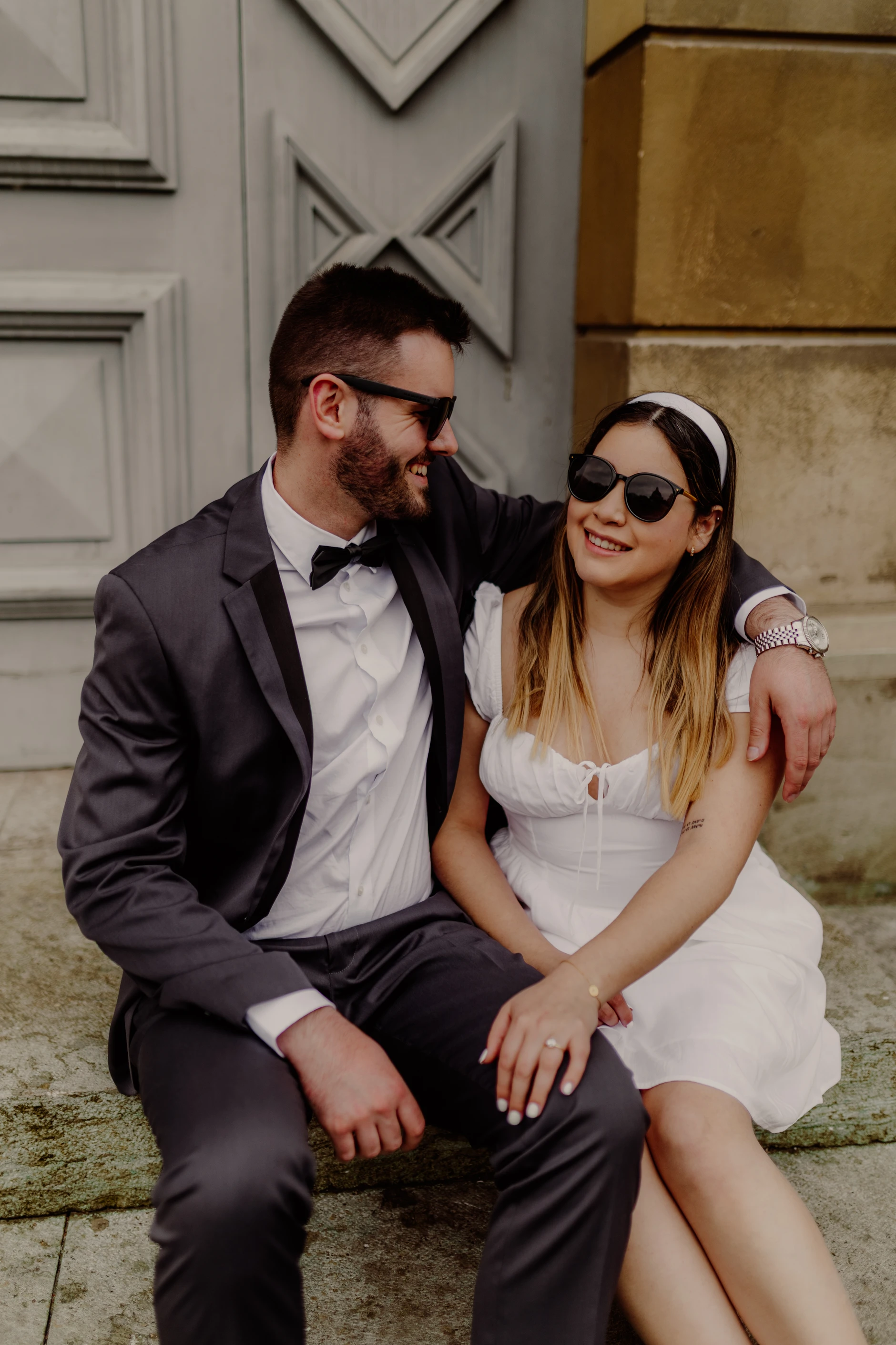 Couple seated on the Rathaus staircase