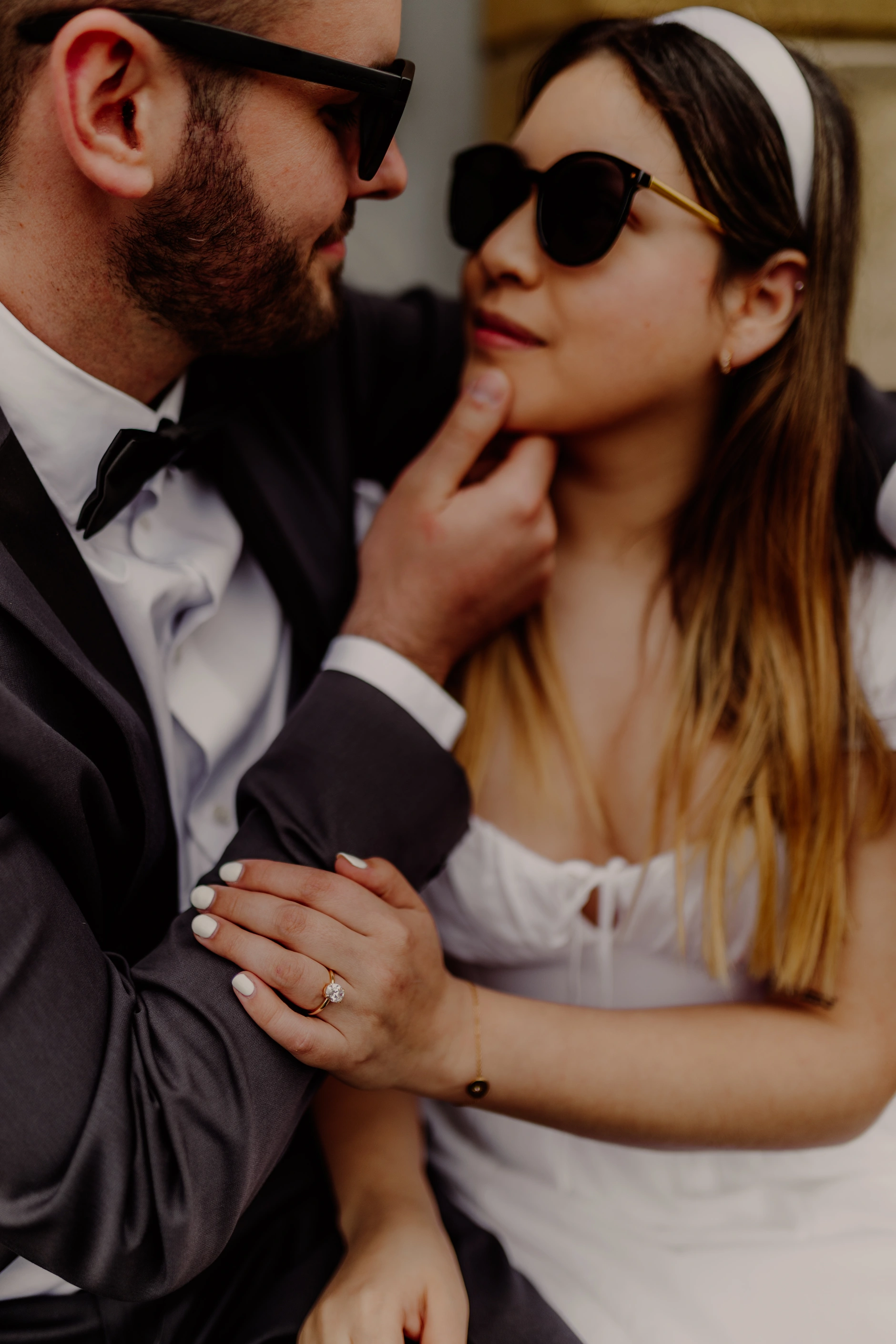 Close-up of sunglasses and smiles in warm tones