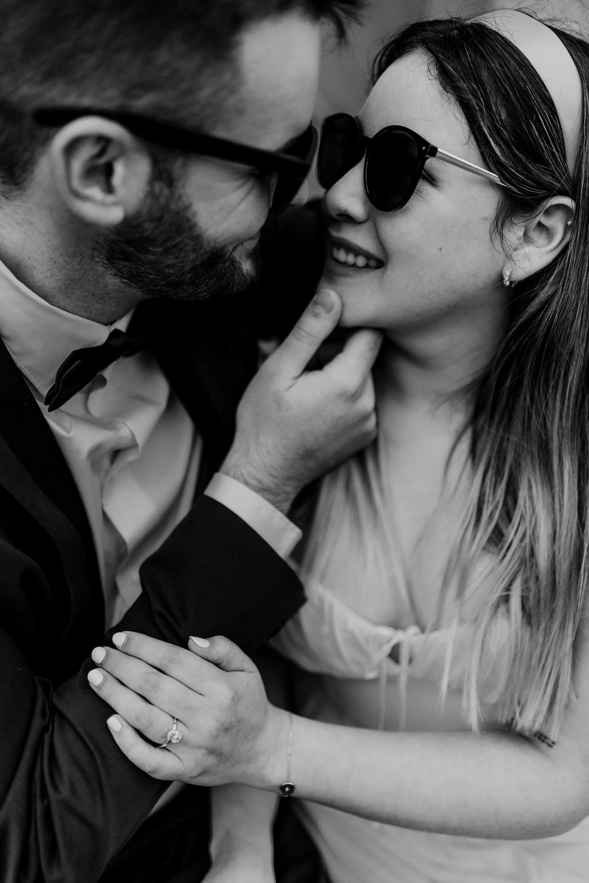 Black and white candid of the couple laughing together