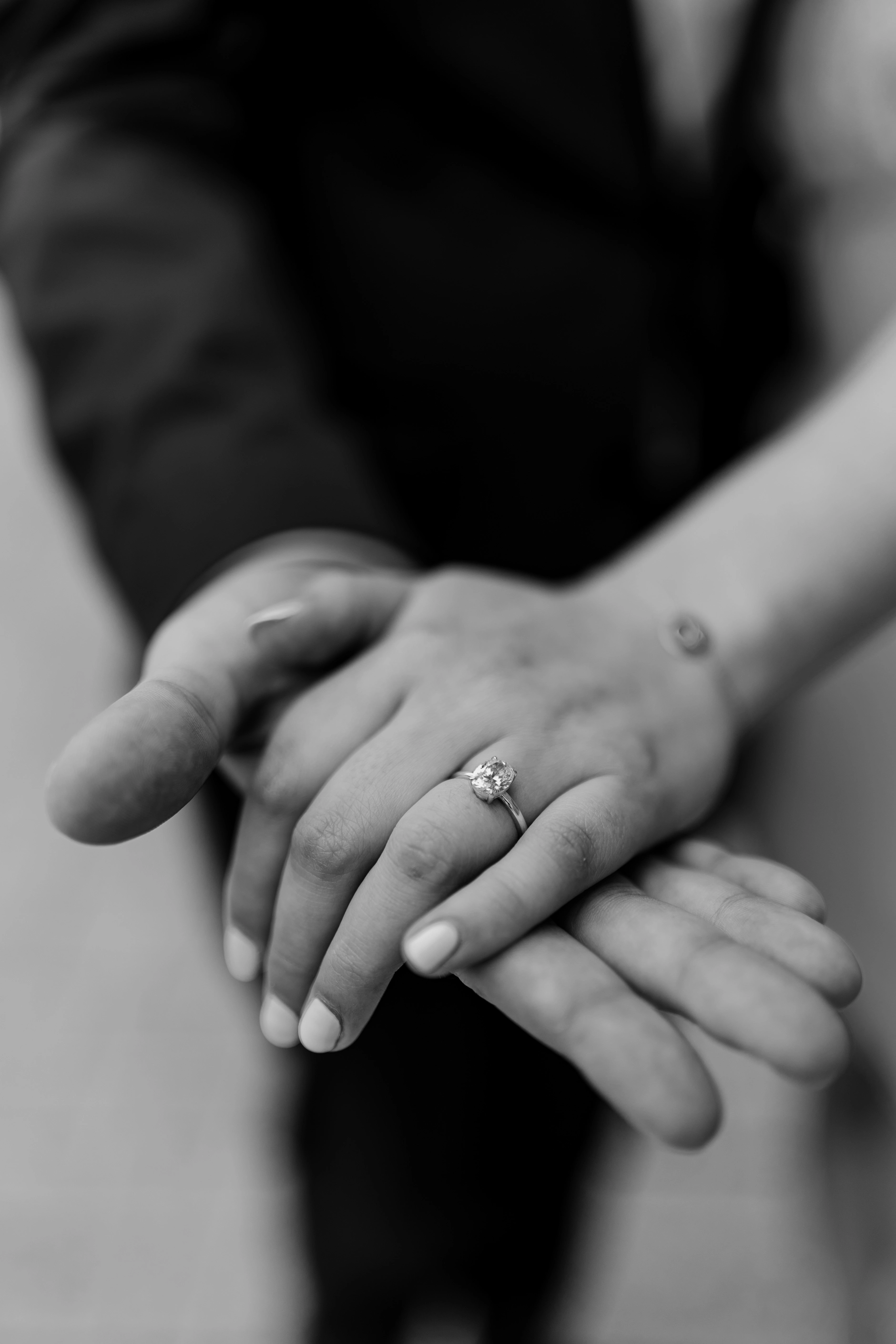 Black and white detail of interlocked hands