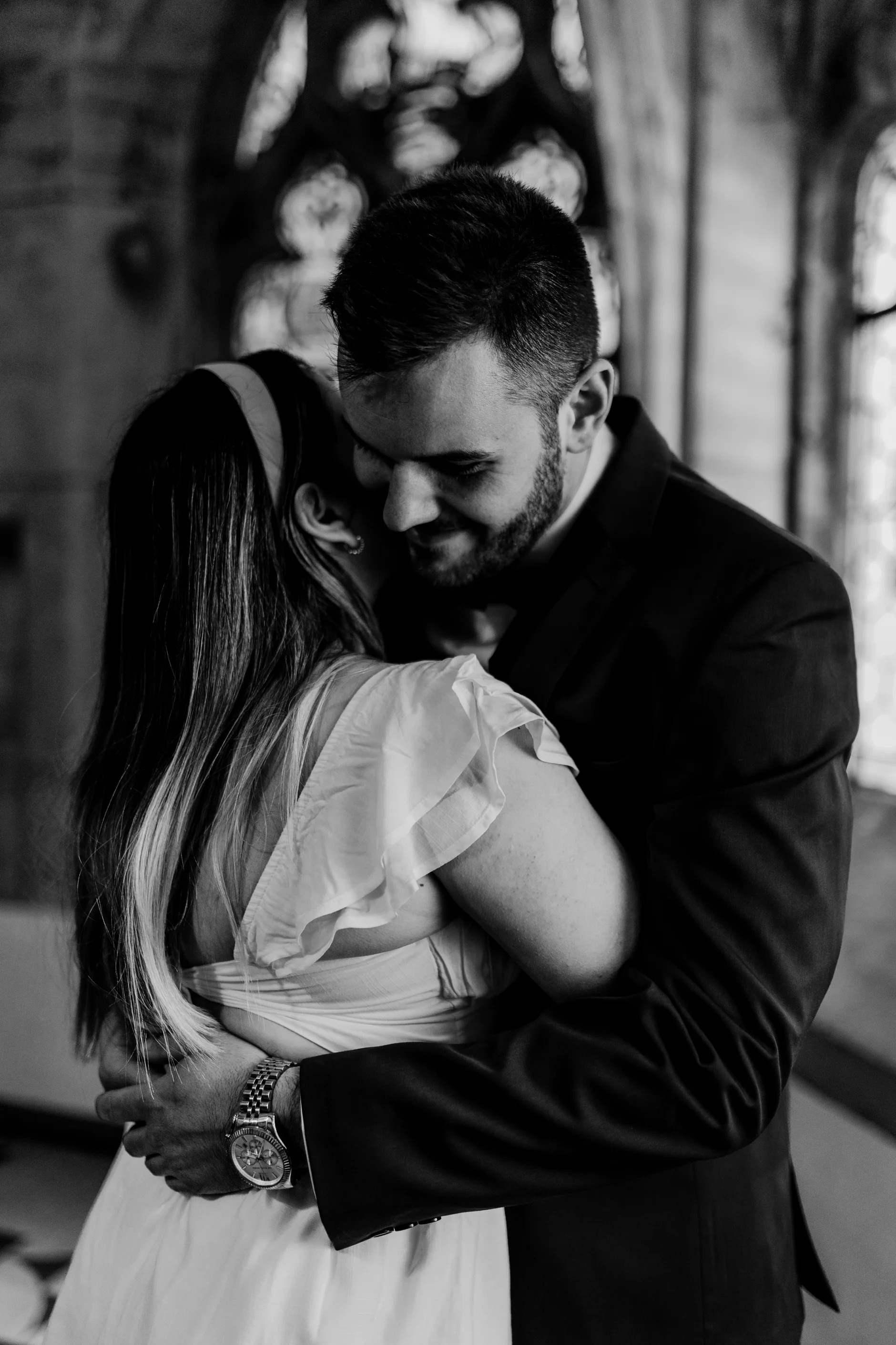 Black and white bride portrait near historic windows