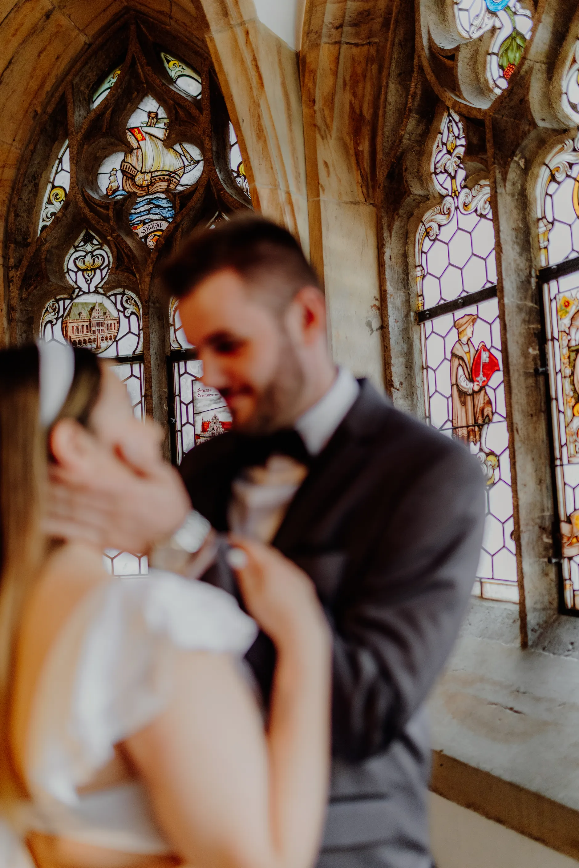 Intimate couple portrait with gothic arches in the background