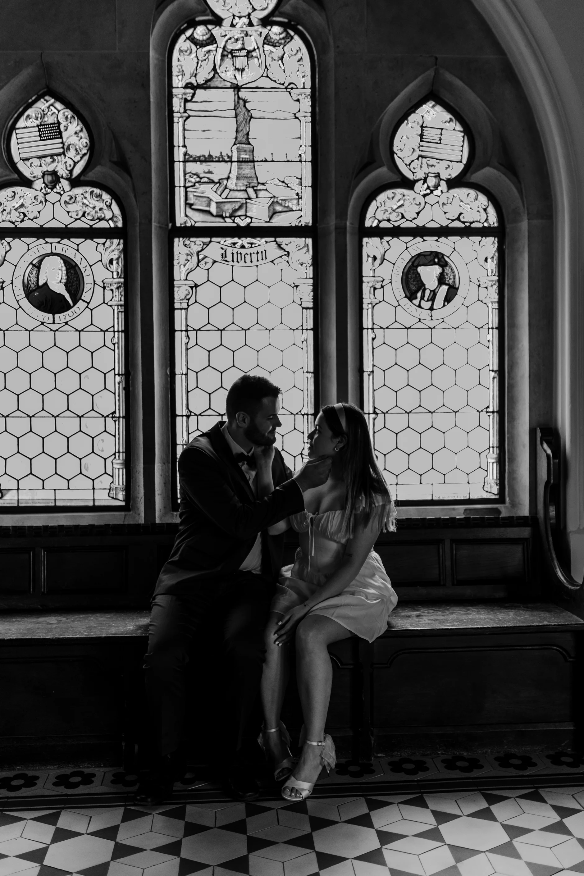 Black and white couple portrait by the window