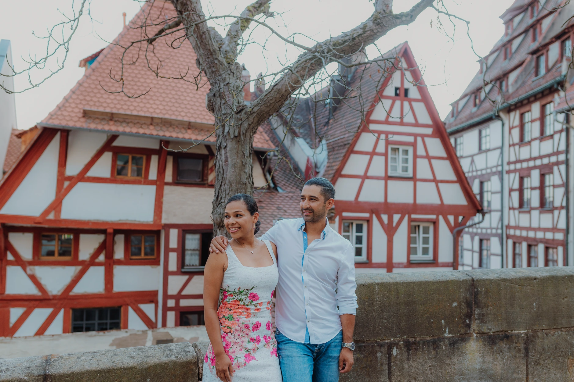 Couple in front of half timbered houses in Old Town