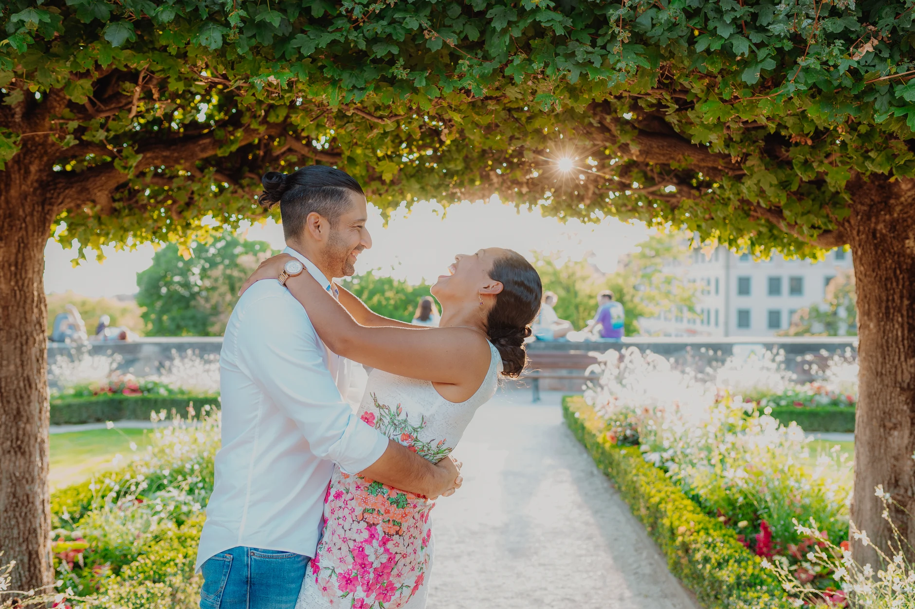 Couple dancing under the tree in evening light