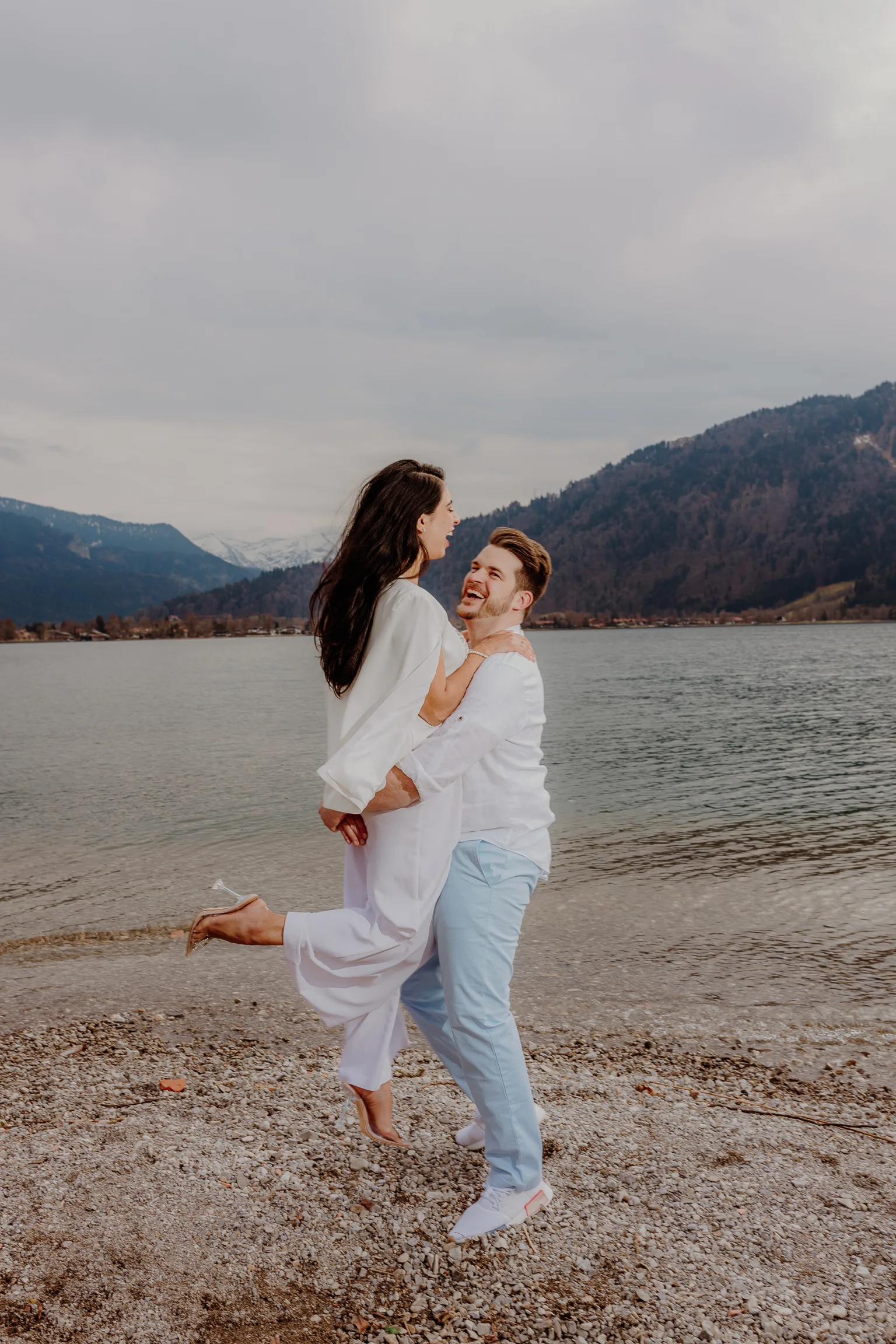 Couple walking together on the shoreline
