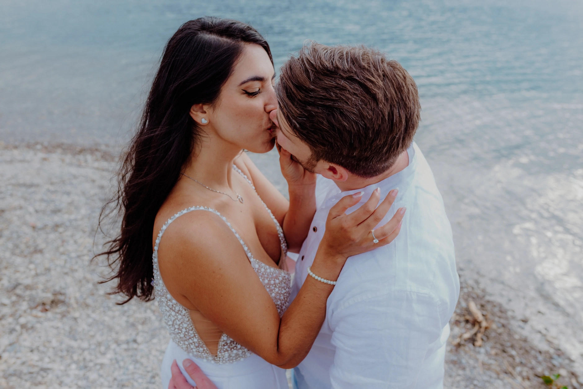 Intimate close-up of the couple by the water