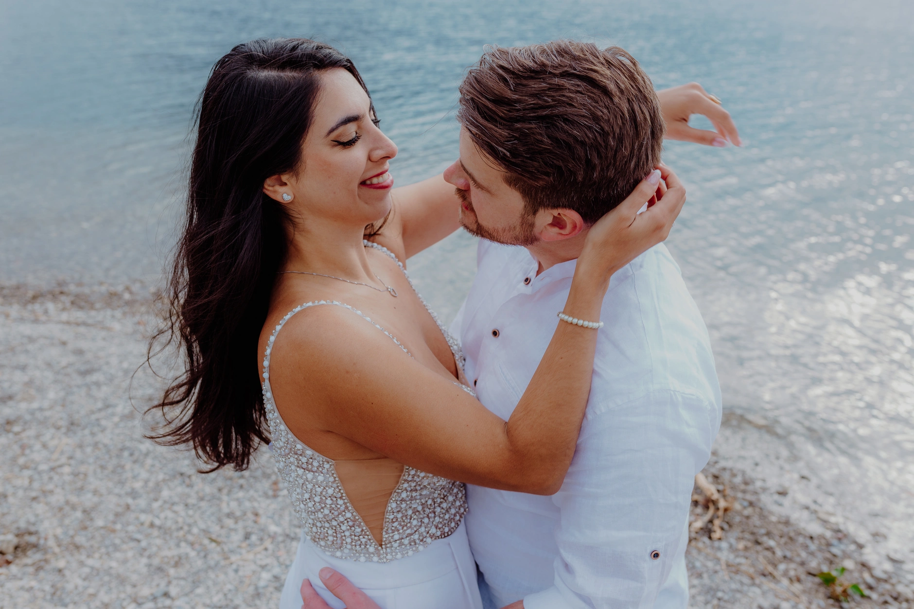 Tender forehead touch portrait near the lake