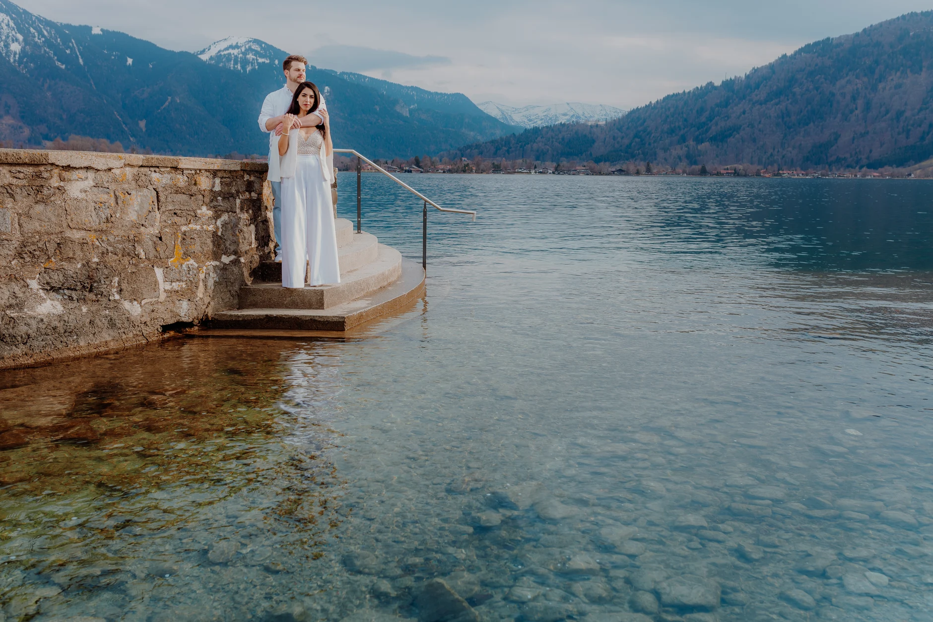 Bride standing on a small dock over Tegernsee