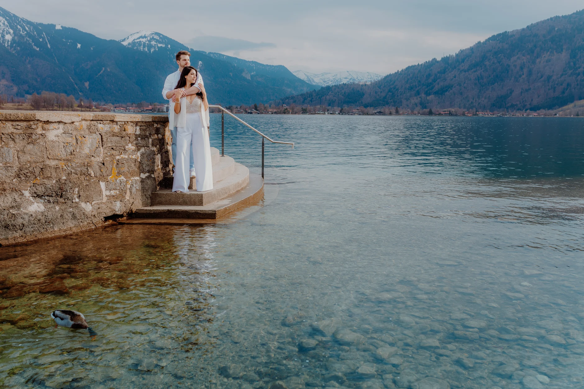 Bride portrait on the pier with mountain reflections