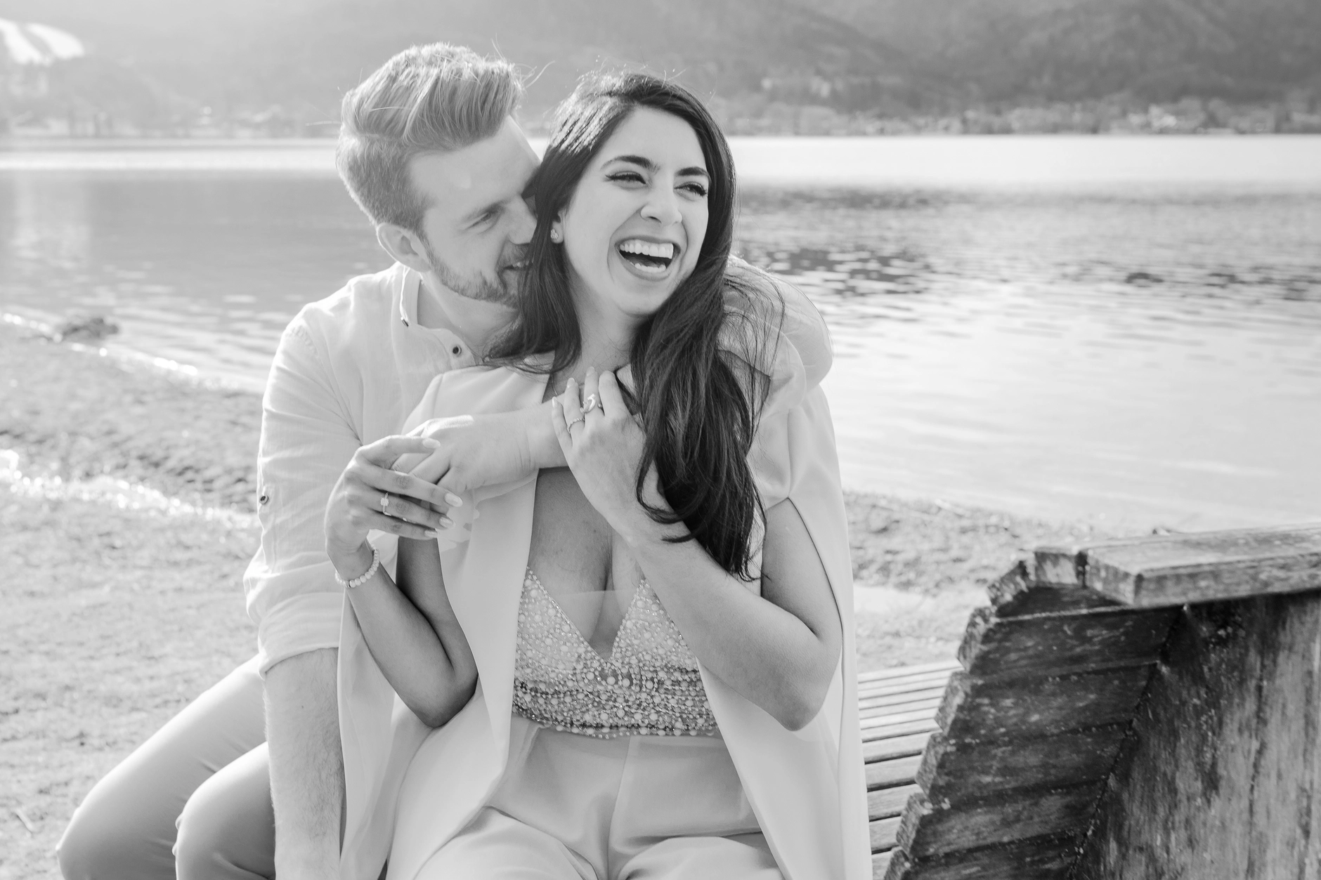 Black-and-white laughing portrait of the couple