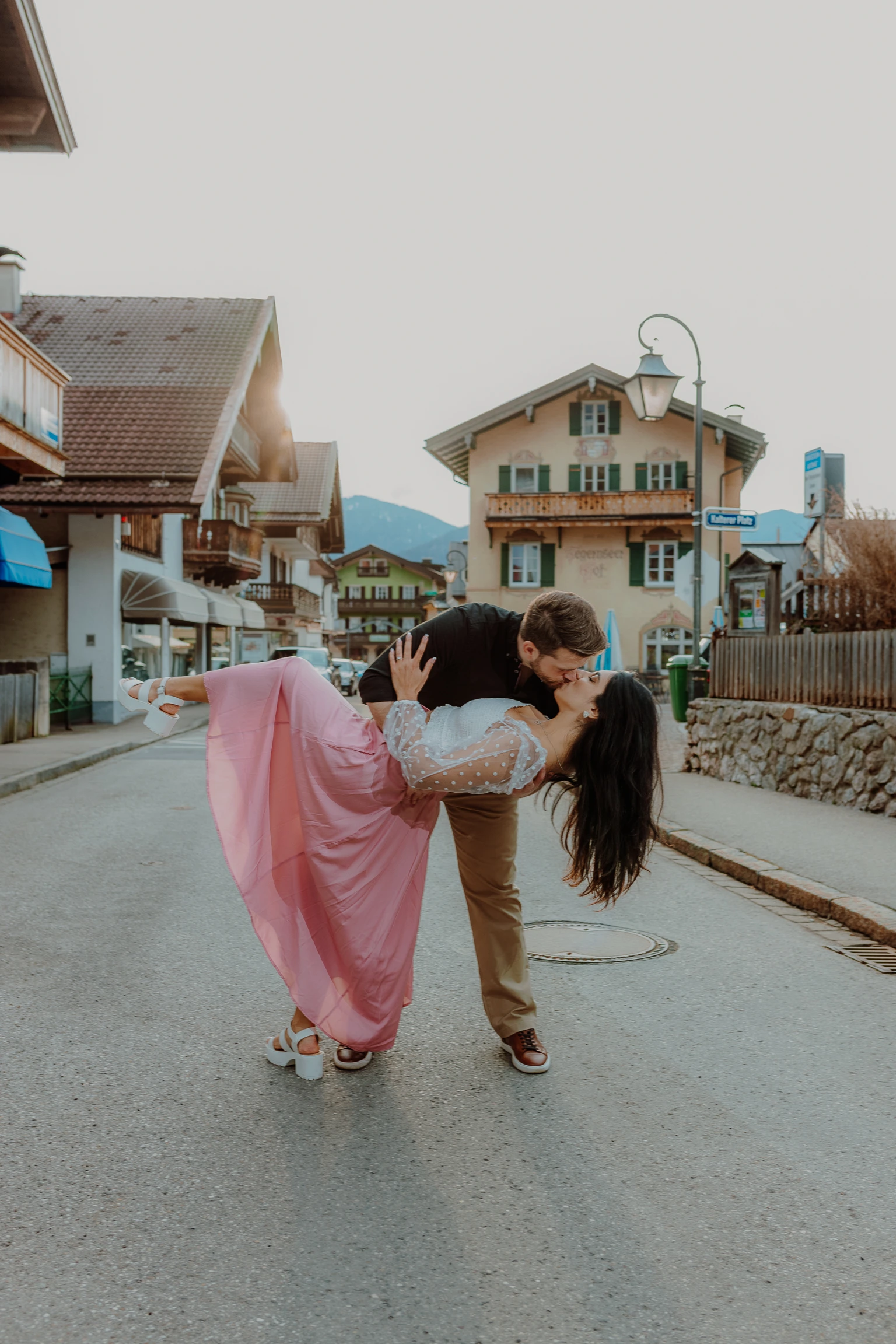 Couple walking through a Bavarian village street