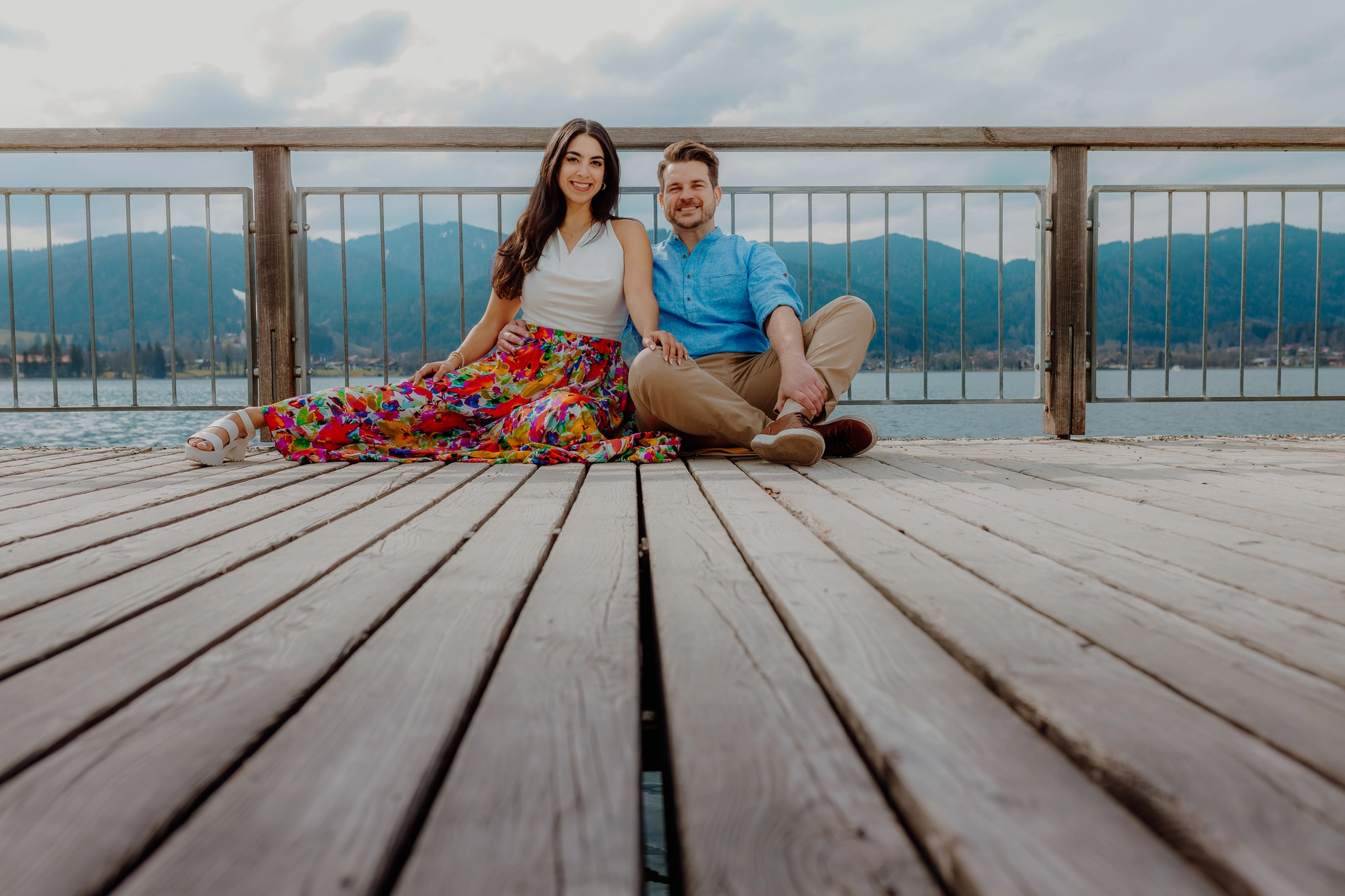 Couple picnic on the wooden boards with flowers