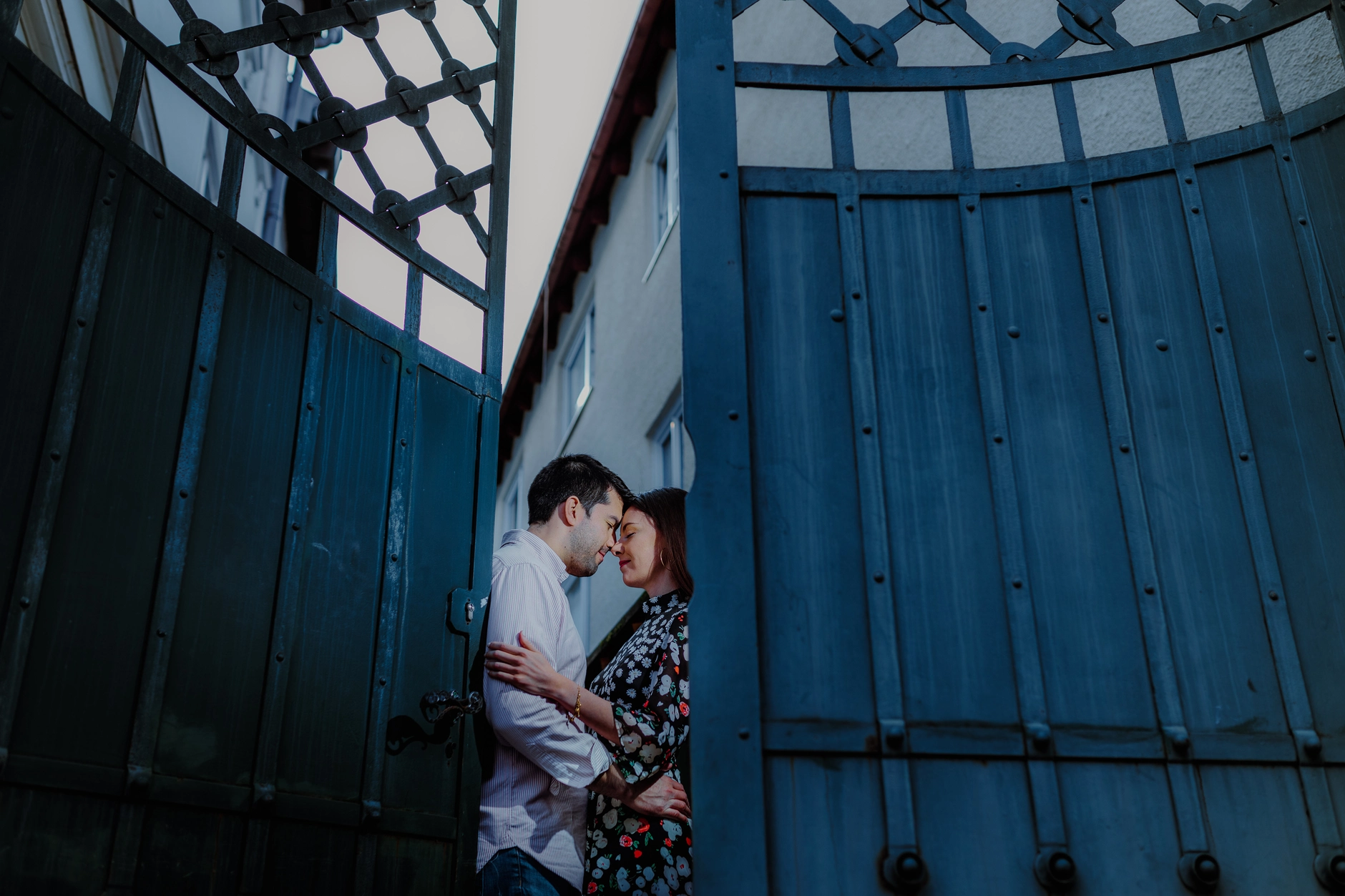 Woman by a blue staircase in an urban setting
