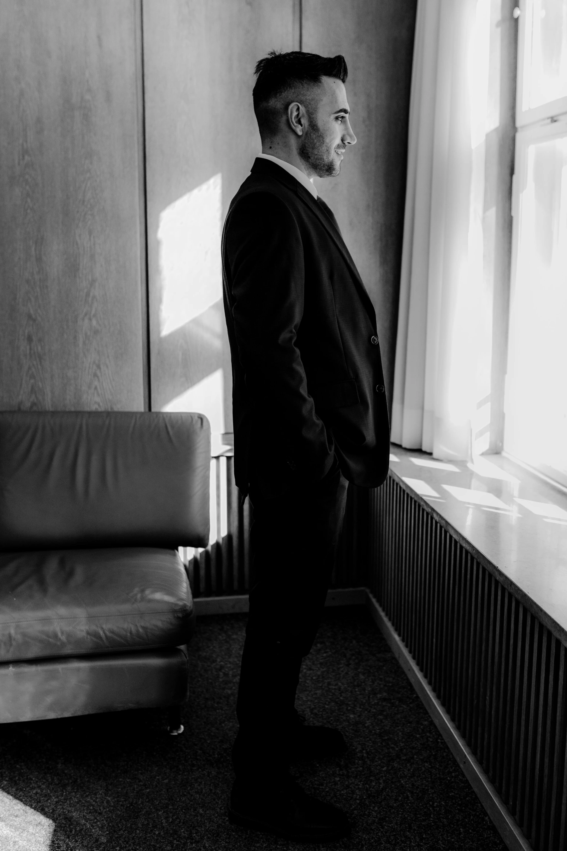 Africa and Yussuf, groom waiting by the window before signing documents