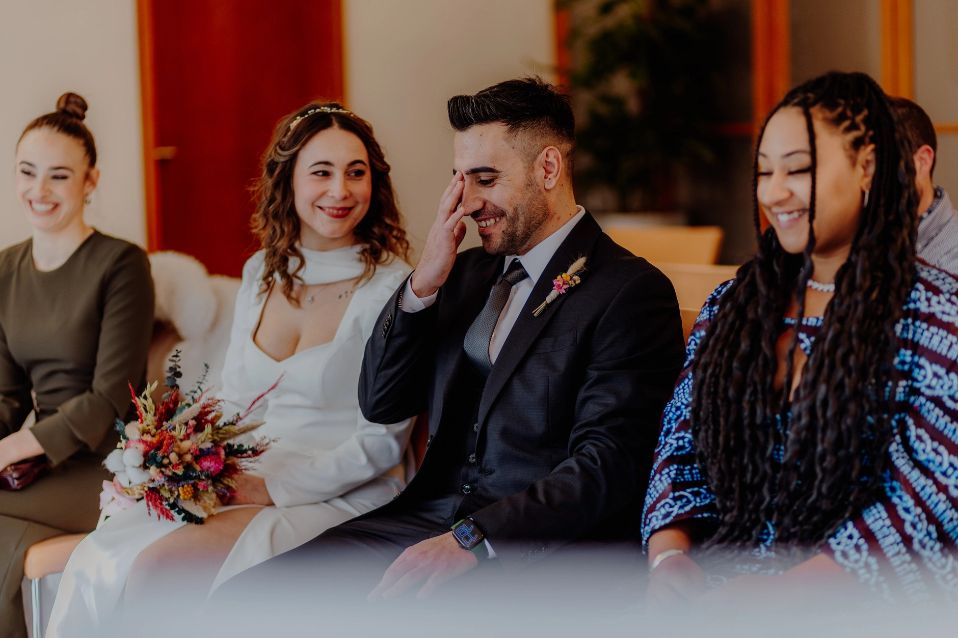 Africa and Yussuf, guests seated and listening during the ceremony