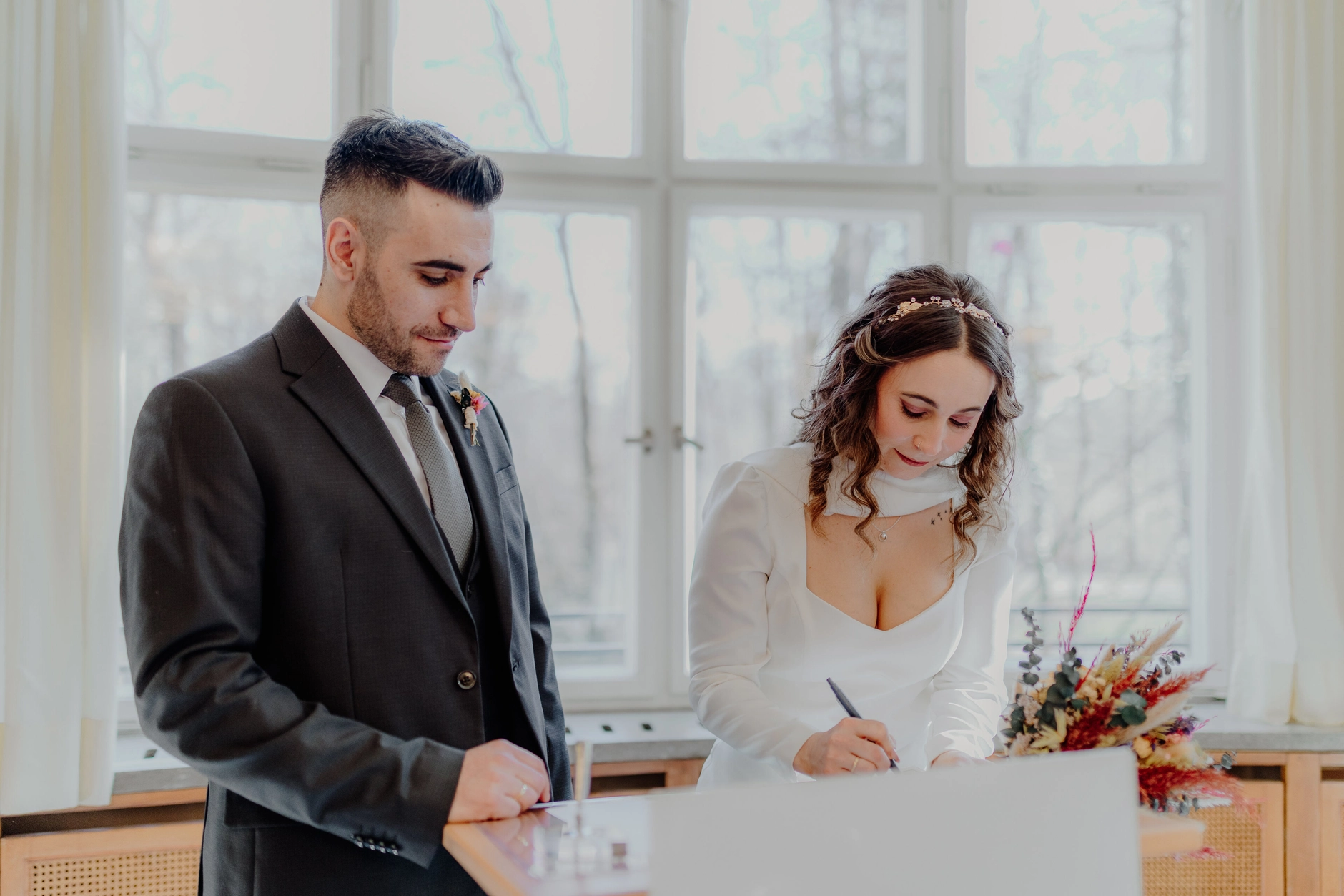 Africa and Yussuf, close-up of joined hands and a red wedding bouquet