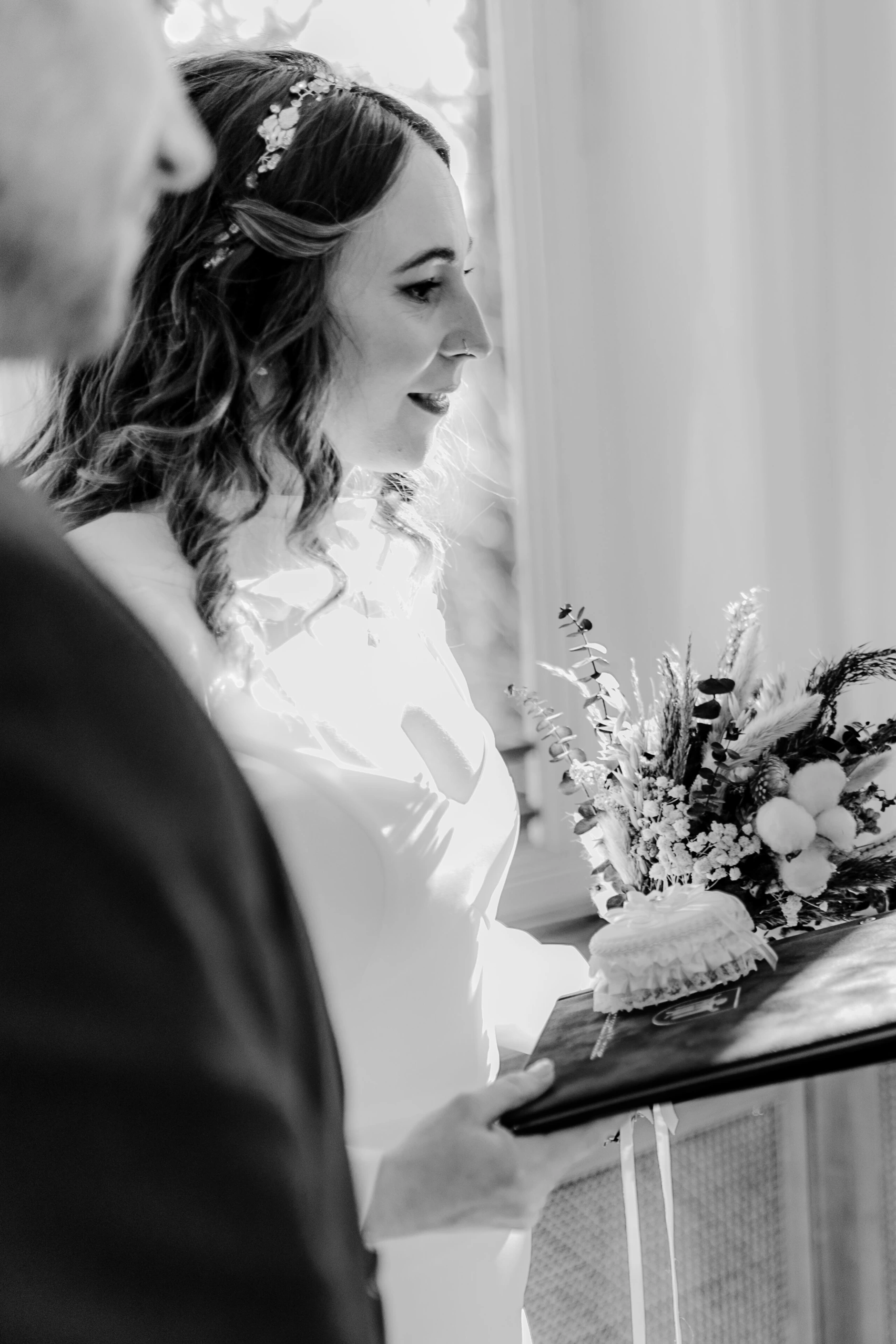 Africa and Yussuf, smiling guests watching the ceremony