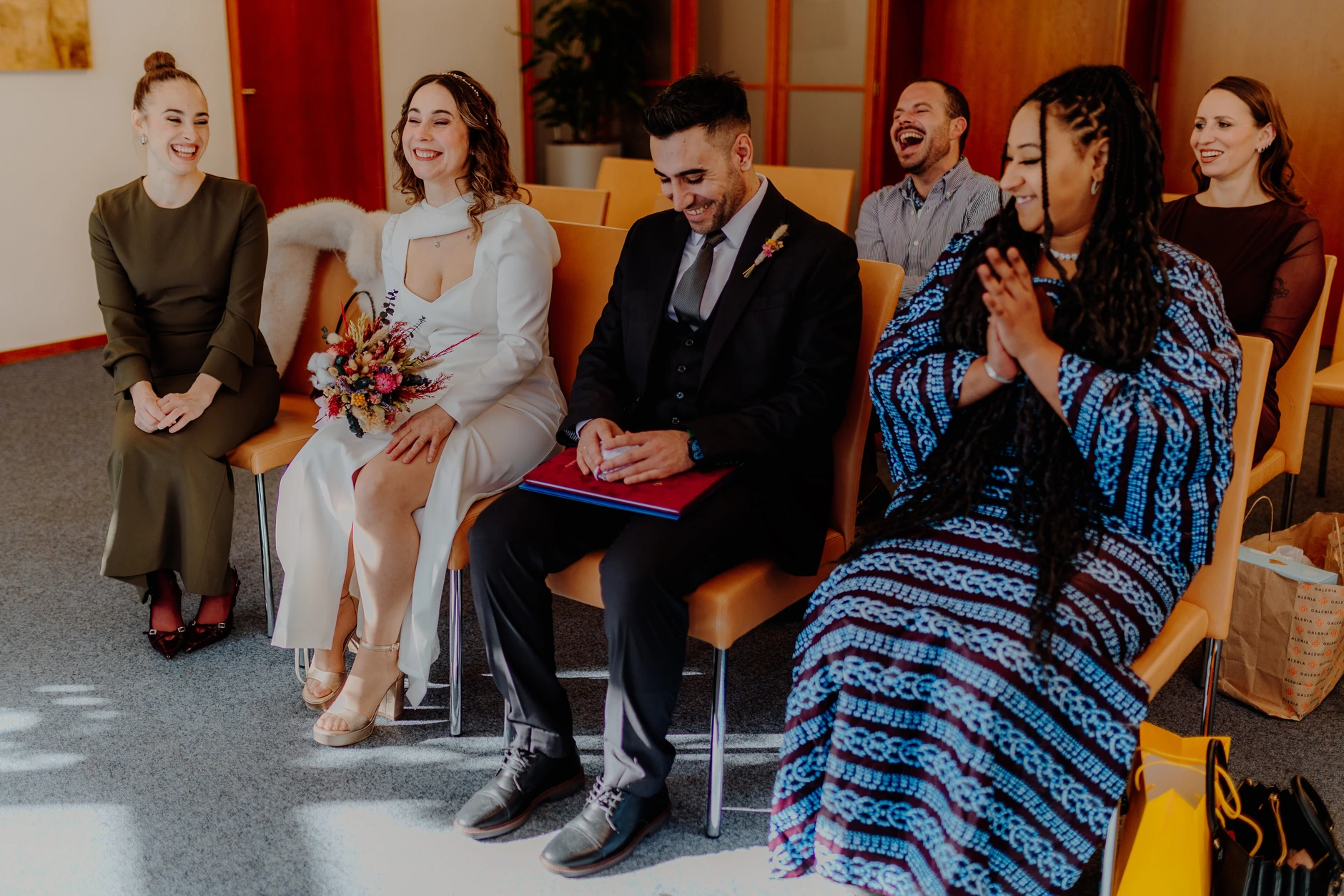 Africa and Yussuf, guests in colorful attire during the civil wedding ceremony