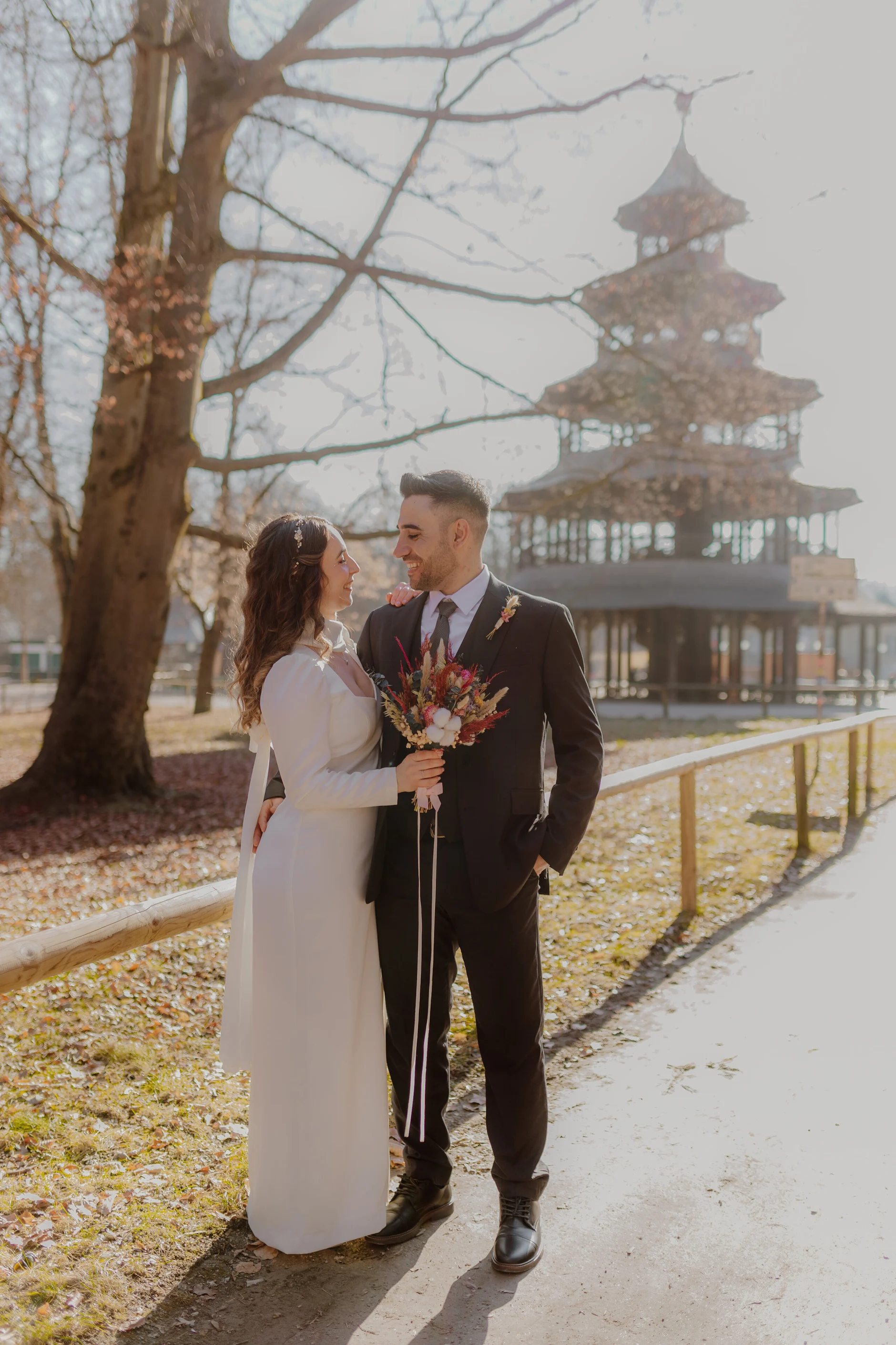 Africa and Yussuf, full-length outdoor portrait near the pagoda in Munich