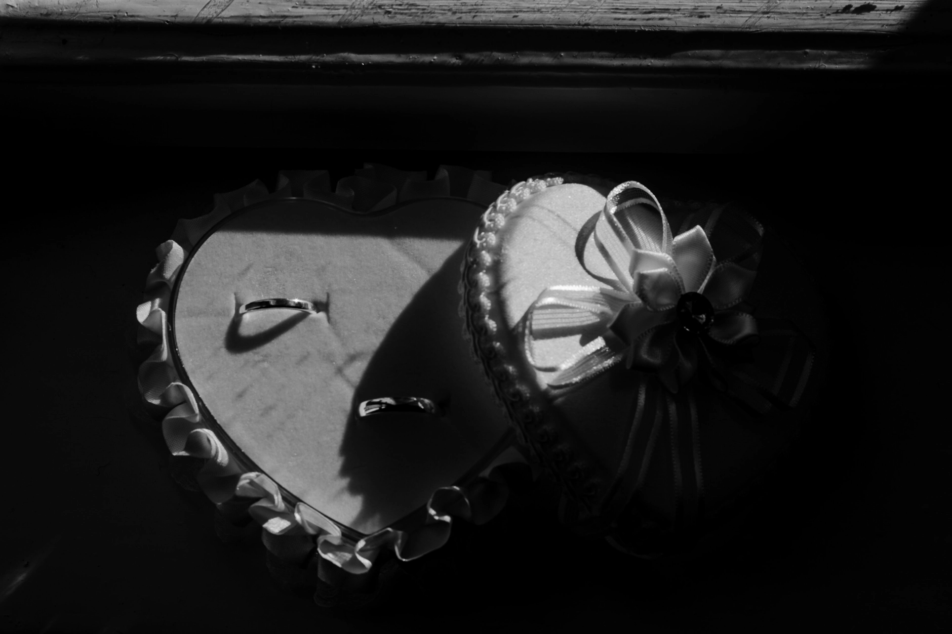 Africa and Yussuf, black-and-white close-up of wedding rings before the ceremony