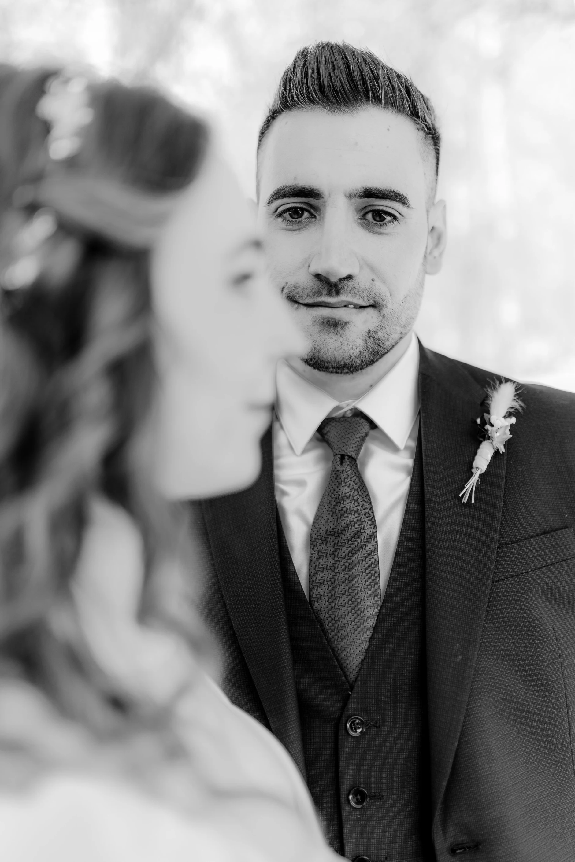 Africa and Yussuf, black-and-white close-up portrait of the groom outdoors