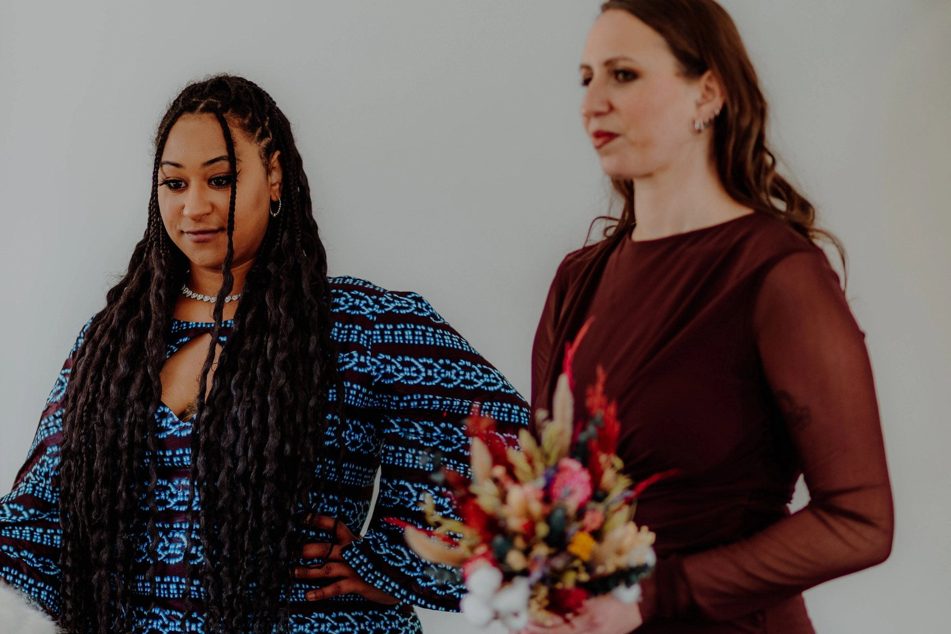 Africa and Yussuf, bride with two guests and bouquet during the ceremony