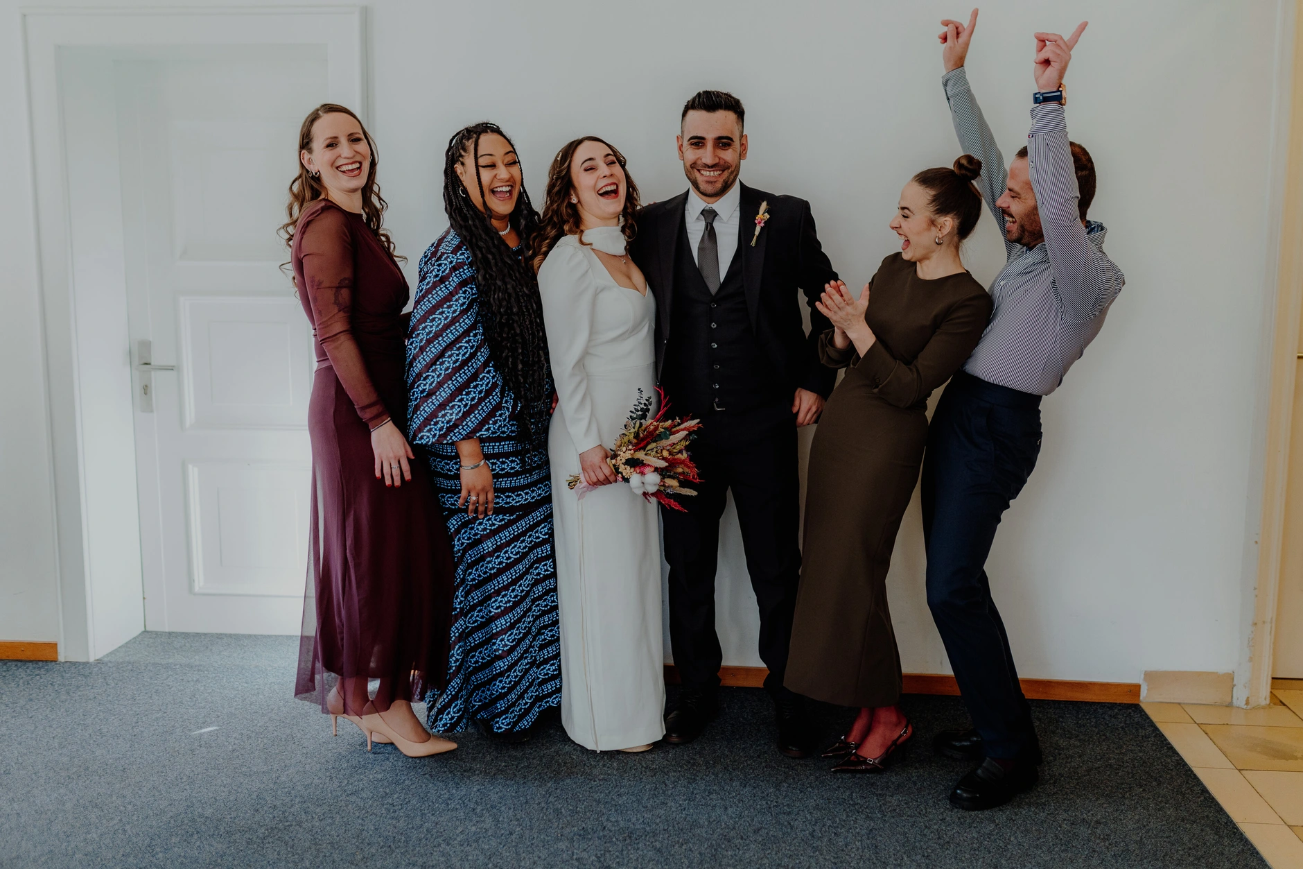 Africa and Yussuf, group portrait of wedding guests in the registry office